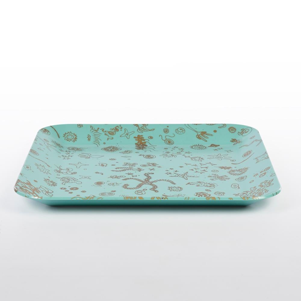 A great example of the classic and, very rare, 'Sea Things' square serving tray by Waverly Products designed by Ray Eames. The gold printing is still prominent on the blue Zenaloy plastic.