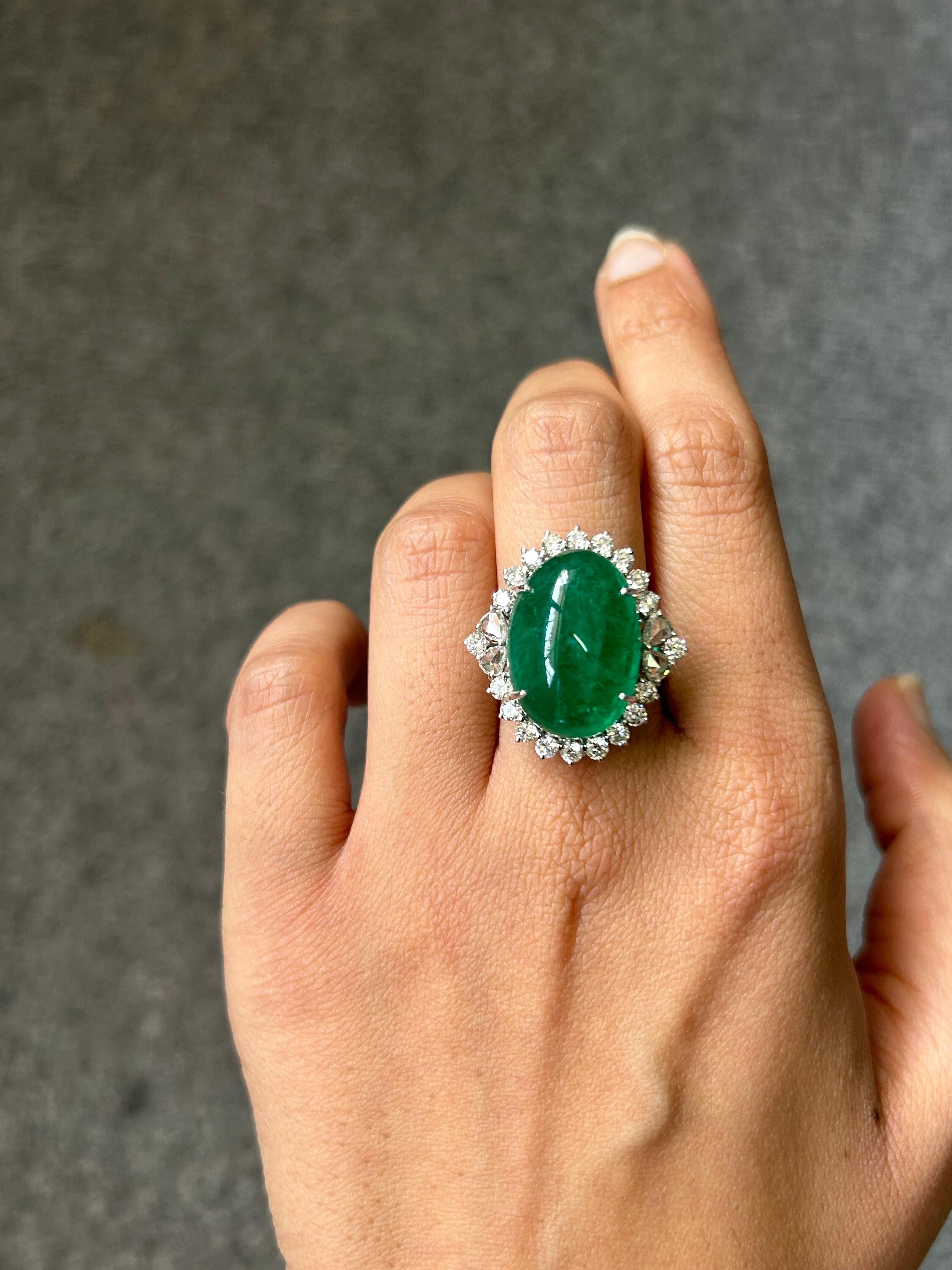 Make a statement with this stunning 19.55 carat Emerald Cabochon and 1.51 carat rose cut and full cut VVS quality White Diamond cocktail ring. The mix of the two Diamond cuts gives the ring an art-deco, yet modern look. The natural Emerald