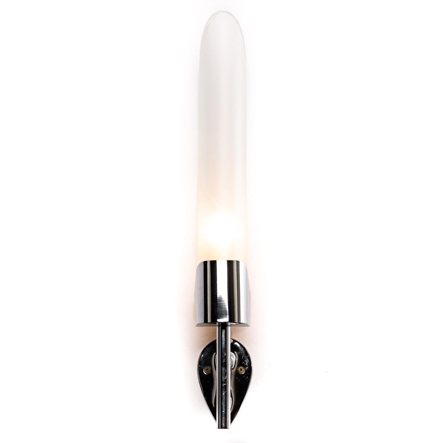 If you like sleek lighting then you will love this pair of Max Ingrand glass sconces. Designed to remind you of candle-lights with frosted bent glass reflector and chrome-plated wall arm, it's a highly distinctive piece and looks stunning when
