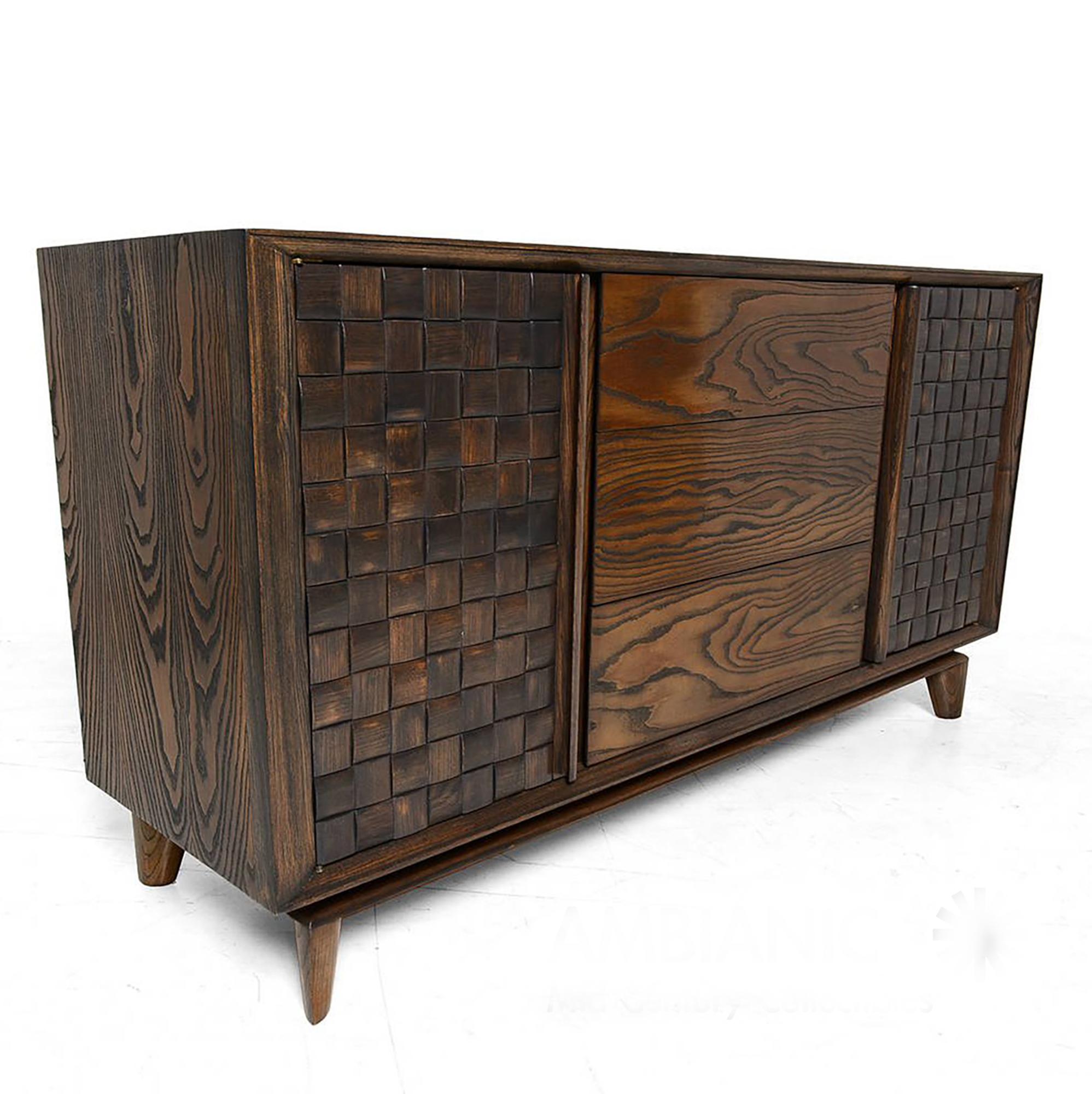 Fabulous fifties classic oak credenza buffet with basket weave checkered design by architect and interior designer Paul Laszlo for Brown Saltman USA 1955. 
Credenza has two open storage areas with shelves- three pull-out drawers. 
All drawers are