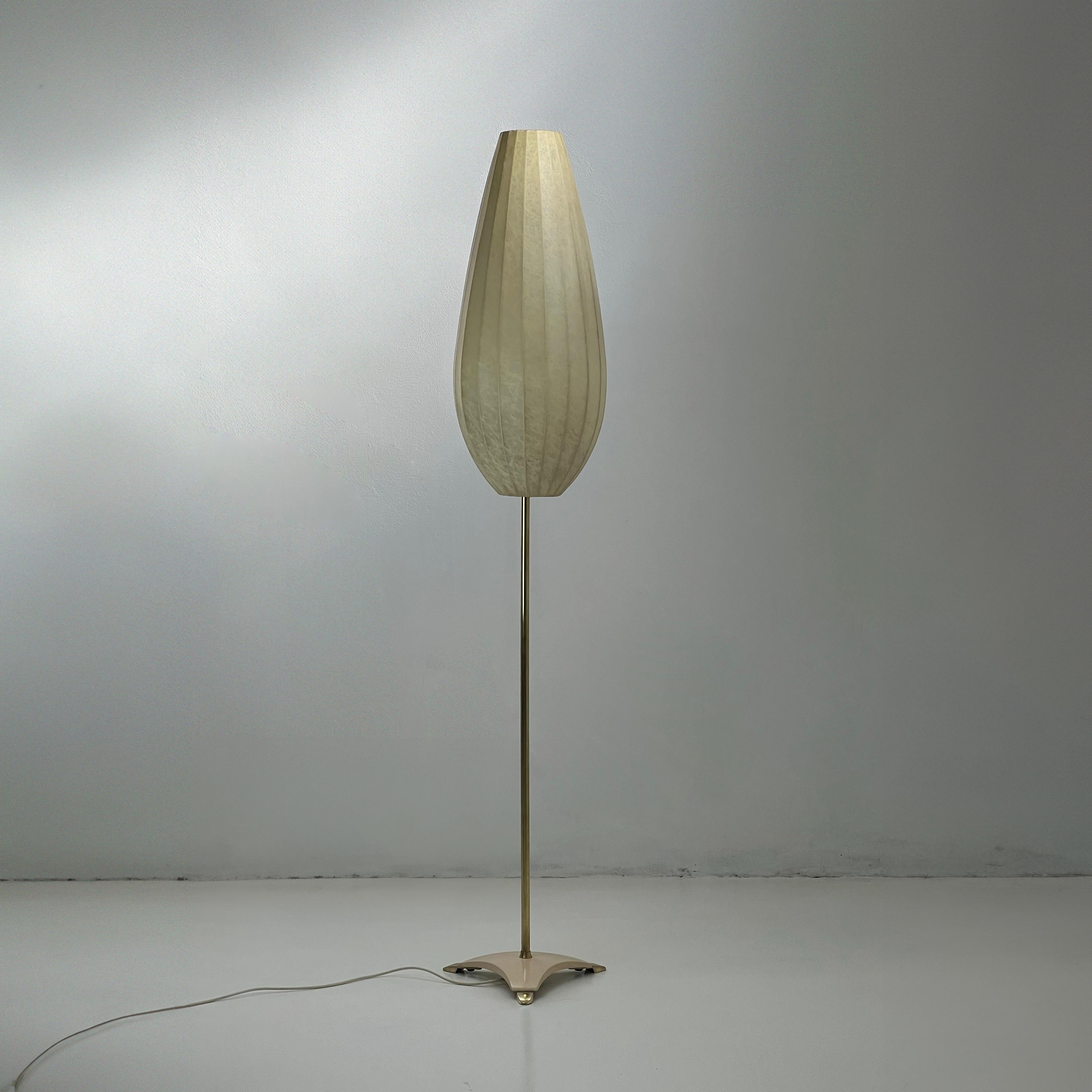 Rare cocoon floor lamp with brass and cast iron base, produced and designed  by A.Eisenkeil. Italy, 1955

Introducing our stunning floor lamp from 1955, a true masterpiece in cocoon, brass, and painted metal. Standing tall at about 160cm, it casts a