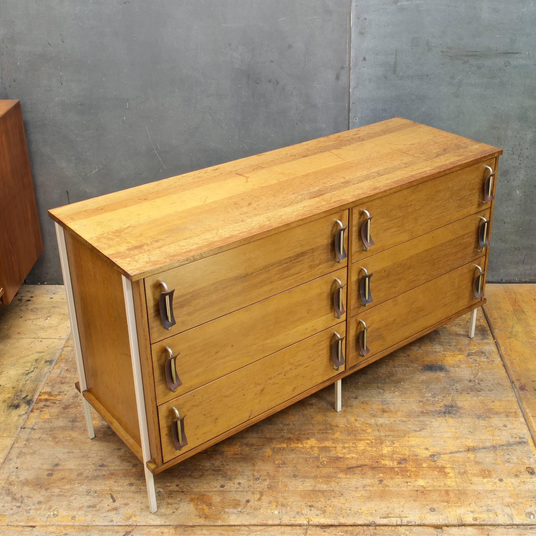 Very low production numbers, produced for only one year. True midcentury experimental rarity. No label or makers mark apparent. Solid wood construction, a heavy piece. Finished back.

Presented in original finish. A very Rare dresser designed by