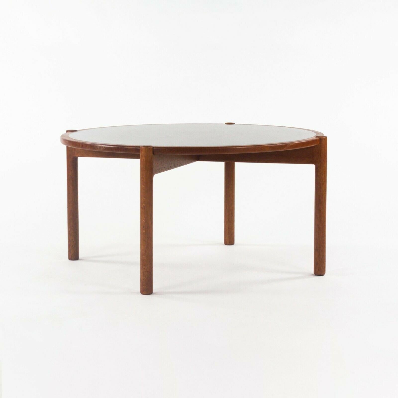 Listed for sale is a Hans Wegner for Johannes Hansen flip top coffee table (or could be used as a large end table). The table appears to be constructed from brown oak, which has patinated beautifully over the years. This is an authentic example,