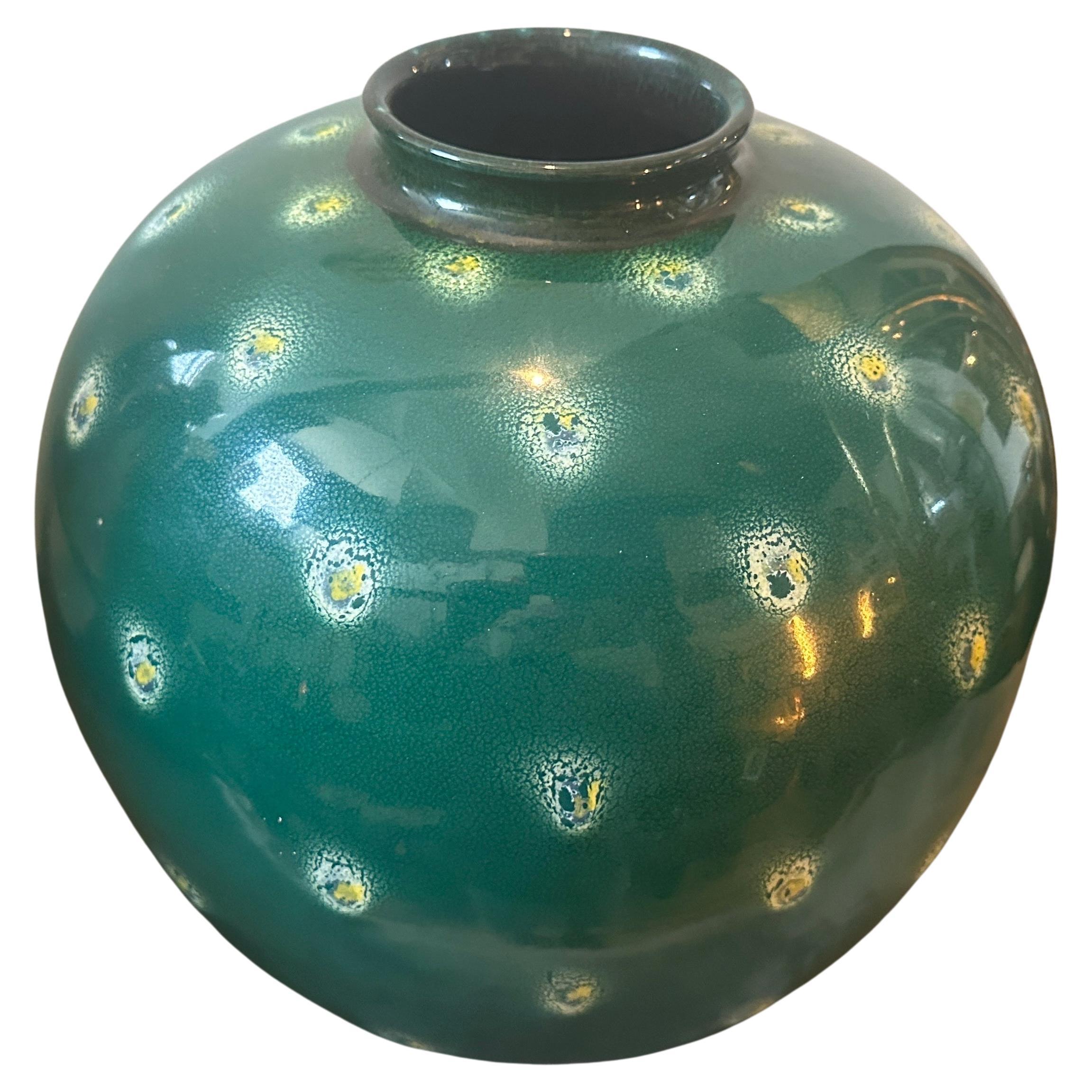 A green ceramic vase dated 1955, designed and manufactured in Sicily in the small town of Santo Stefano di Camastra, famous for hand-crafted ceramics, may items of the period have been influenced by Gio Ponti. The vase is an exquisite example of the