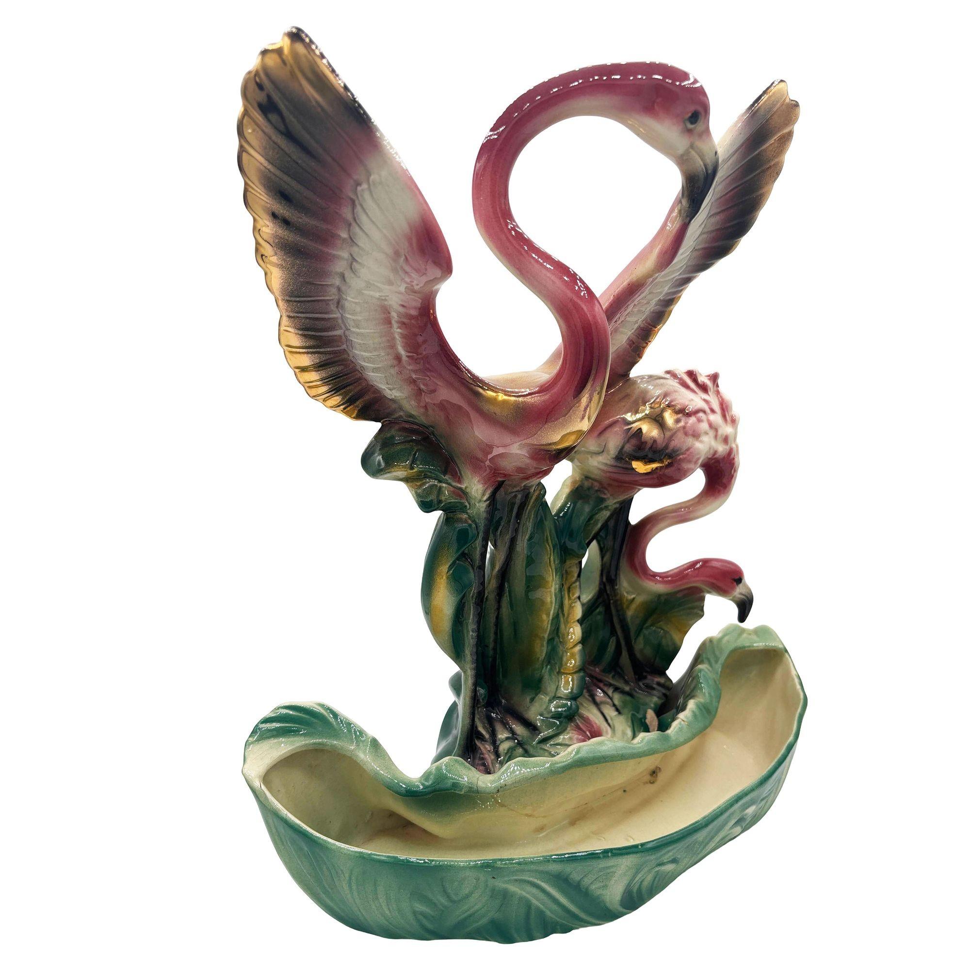 Original 1956 pink and green flamingo ceramic planter, it featuring two beautifully detailed pink flamingos with wings outstretched among lush green leaves, this mid-century piece doubles as both a decorative figurine and a functional planter. The