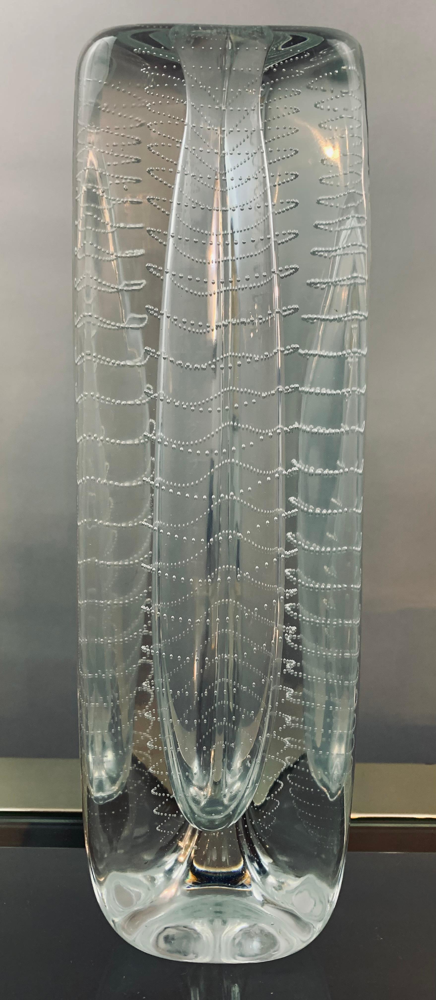 A stunning mid-century art glass triangular vase designed by Floris Meydam. Manufactured by the Royal Leerdam Glass Company in the Netherlands. Circa 1956. 

The vase which is designed for a single flower (solifleur) is hand blown with a spiral of