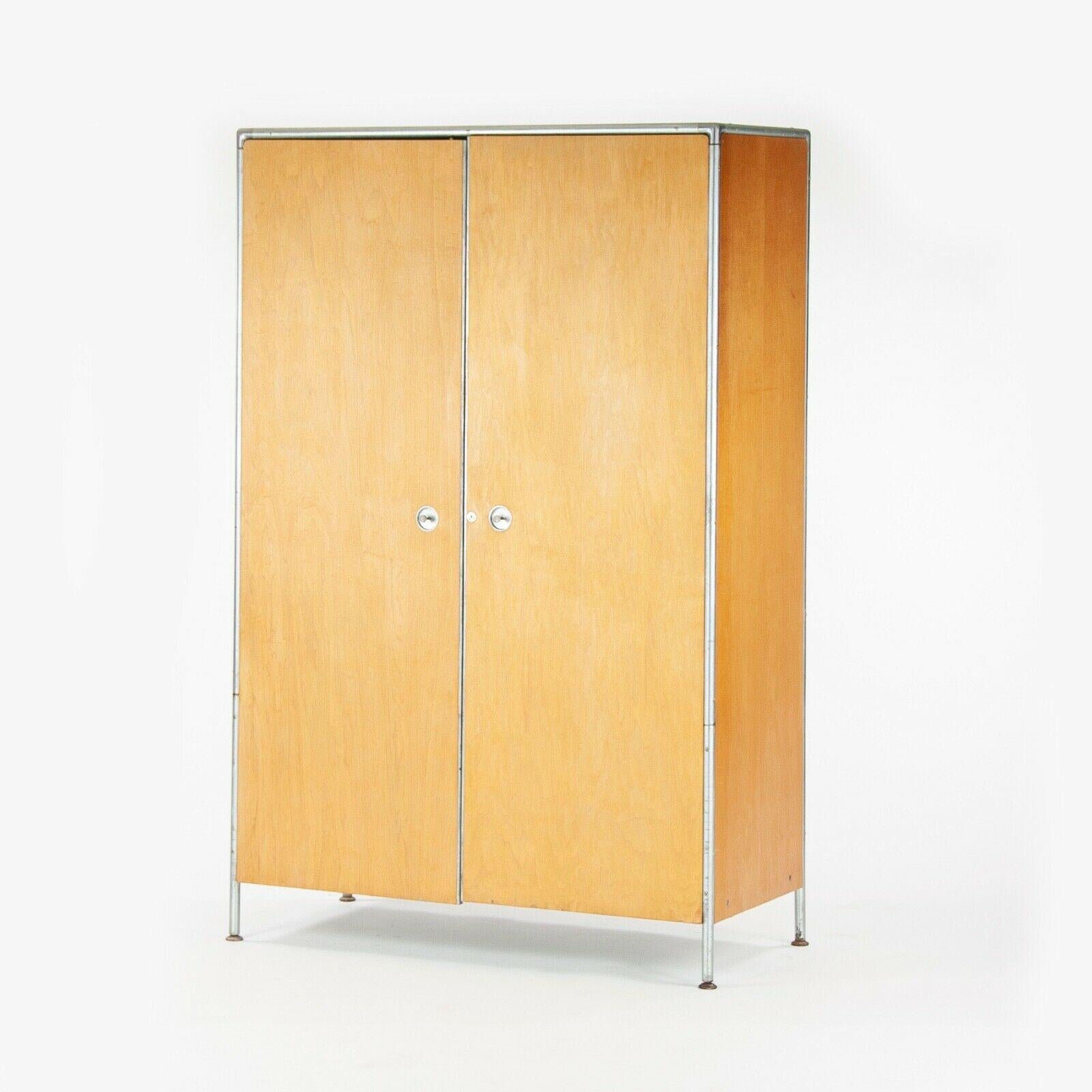 Listed for sale is a circa 1956 vintage Armoire designed by Henry P Glass and produced by the Fleetwood Furniture Company. This example is from Glass' steel tube series, which included numerous rolling carts, bookcases, chests, and other furniture