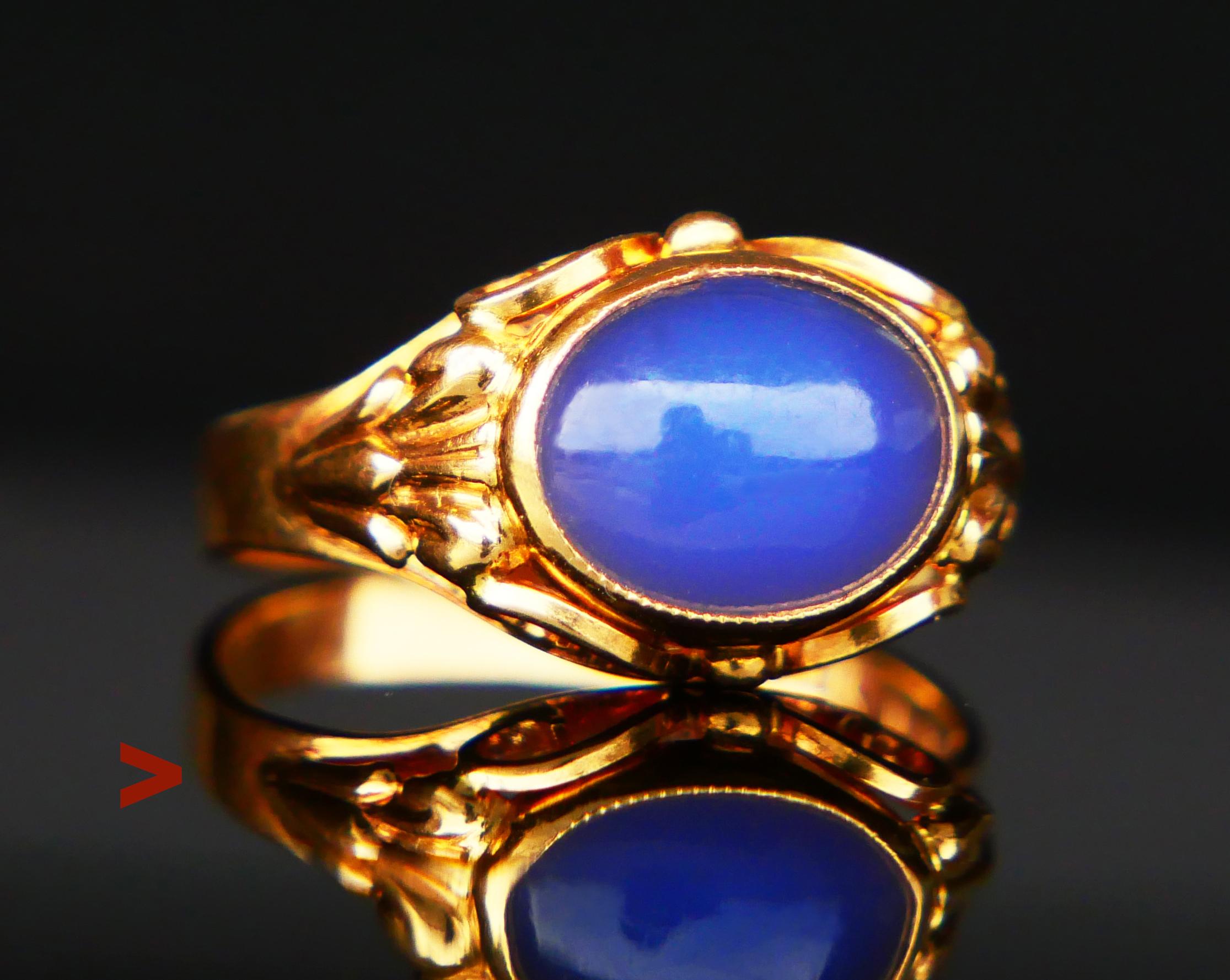 Vintage Ring with bezel set natural Blue Chalcedony stone 10 mm x 8 mm x 3.8 mm deep / ca. 3 ct, of fancy cabochon cut. The color is medium Blue, with  tiny inclusions inside visible under x 10 magnification. The band is from 2 mm to 10 mm at