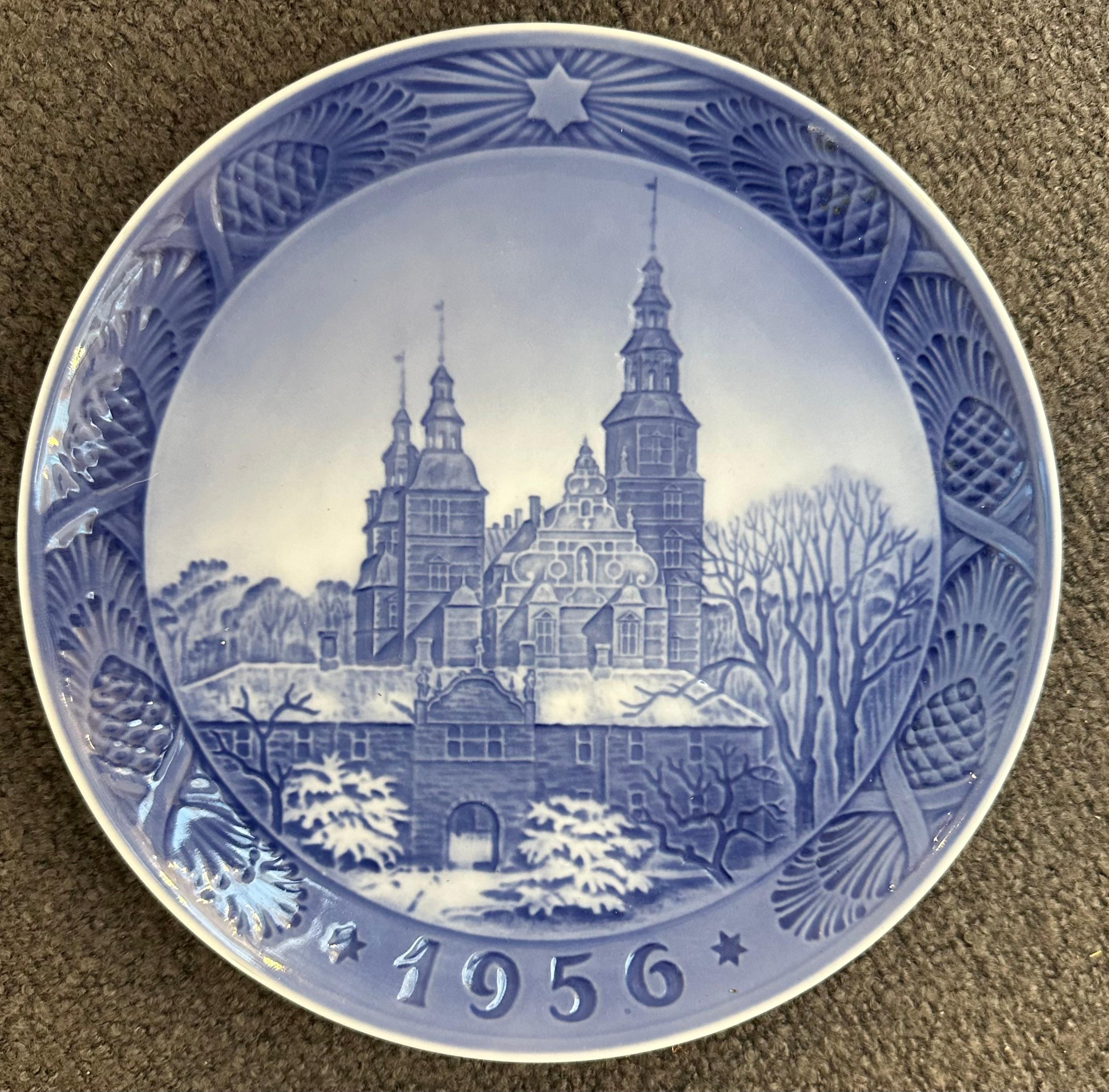This glazed porcelain plate is the Royal Copenhagen Christmas 1956 issue depicting the Rosenborg Castle in the centre of Copenhagen.  Designed and stamped on the reverse Kai Lange. The Castle was built by King Christian IV as his summer residence in