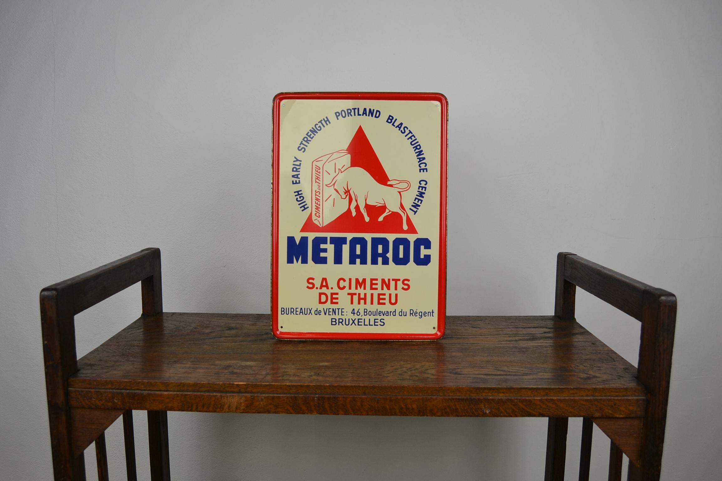 Advertising sign with a Bull for building materials. 
A Mid-20th century publicity sign, advertising sign
made for the company Metaroc Brussels, Belgium.
This company was known for his high early strength Portland Blasturance cement building