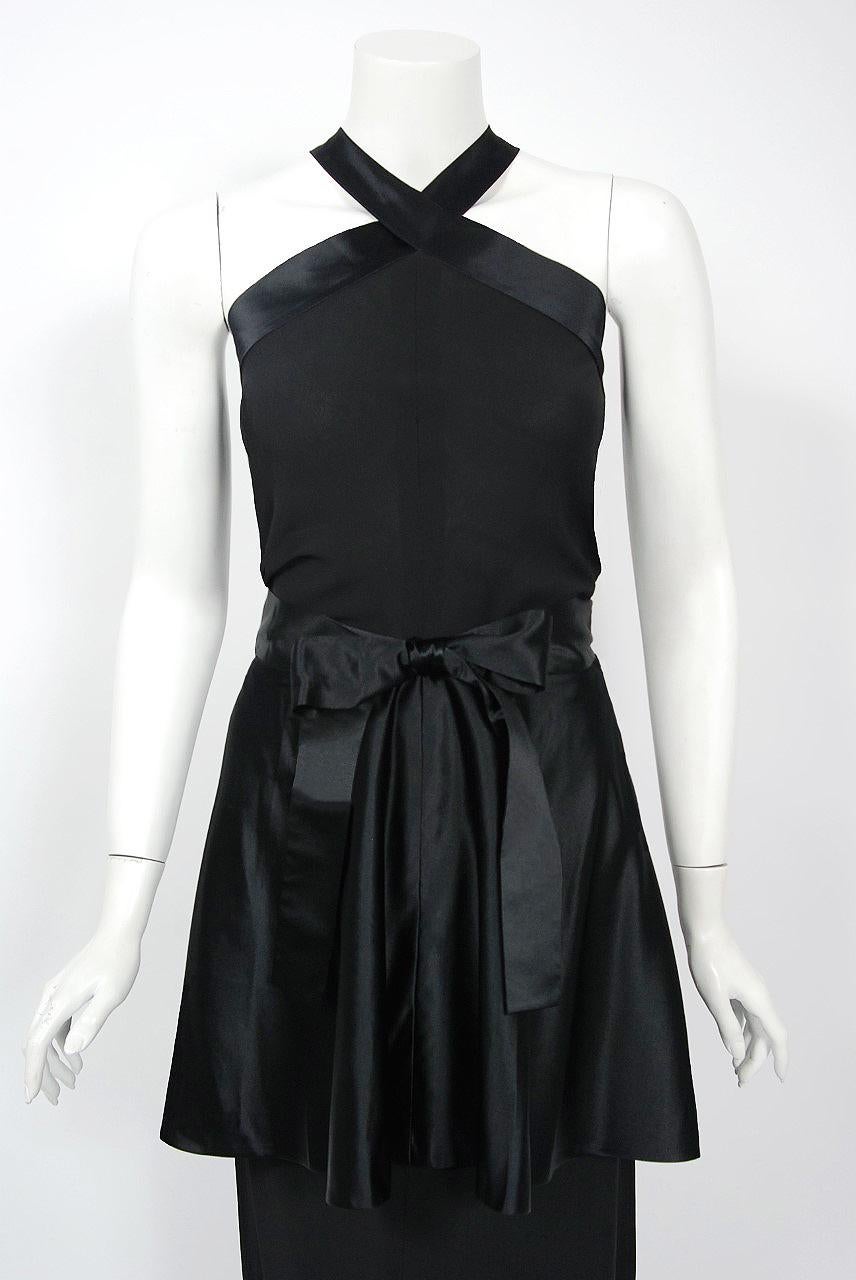 This seductive Traina-Norell designer dress dates back to their 1956 couture collection. Fashioned in midweight silk-rayon & satin, this rare garment exemplifies their signature blend of high-level quality with quintessentially American style;