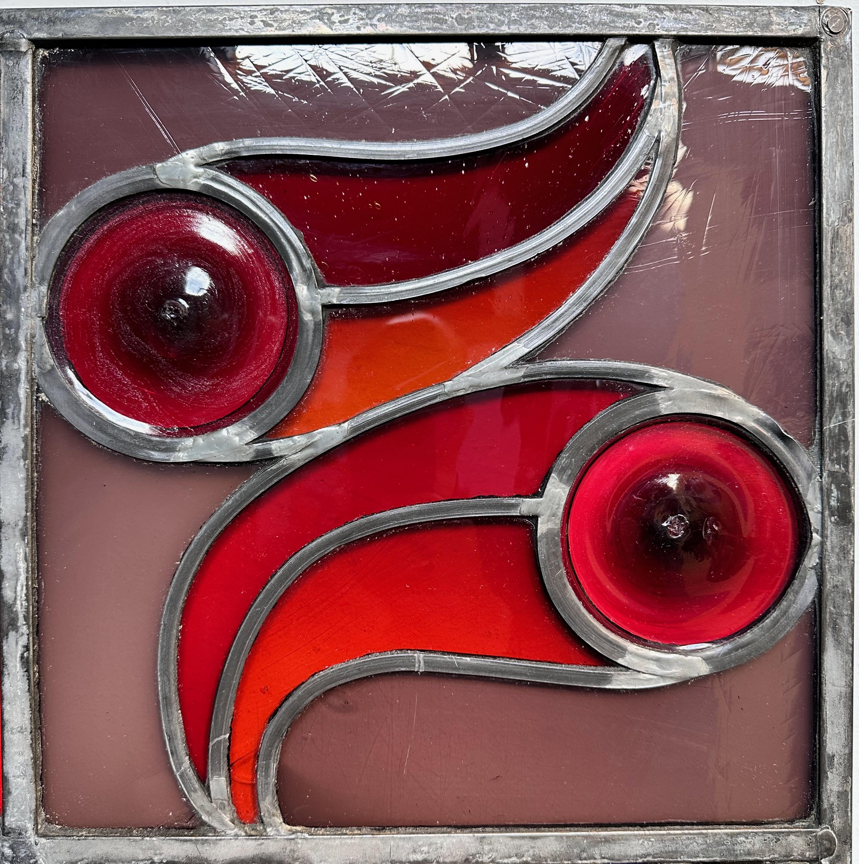 Beautiful leaded glass piece that was originally purchased in 1957 in New York City, panels that use rondel centric panels to portray the four seasons; winter, spring, summer, and fall. Using vibrant colors, this artist has created a wonderful work