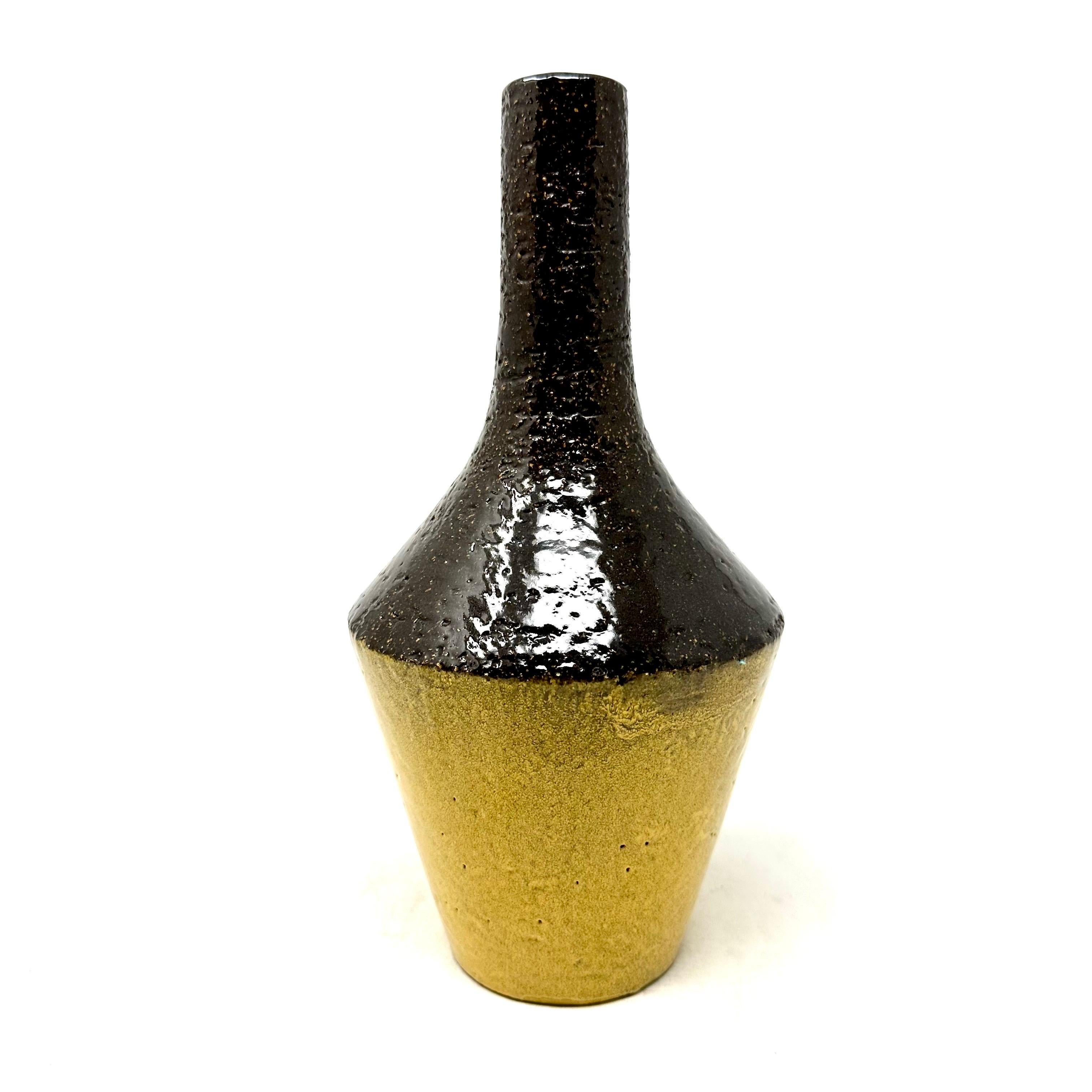 1957 yellow and brown pottery vase by Ingrid Atterberg for Upsala Ekeby, Sweden. In excellent condition, with original sticker. Marked on the underside.

Diameter: 5 in / Height: 10.5 in

—

Ingrid Atterberg (1920-2008) was a Swedish ceramic