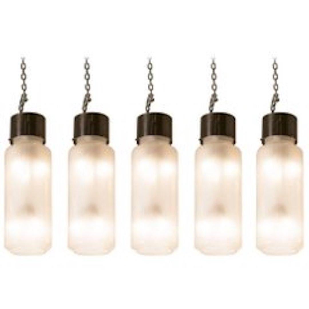 Set of five brushed nickel and glass pendant lights by Caccia Dominioni for Azucena. Pendants have been rewired for the United States. Dimensions are for the glass and metal portion only.