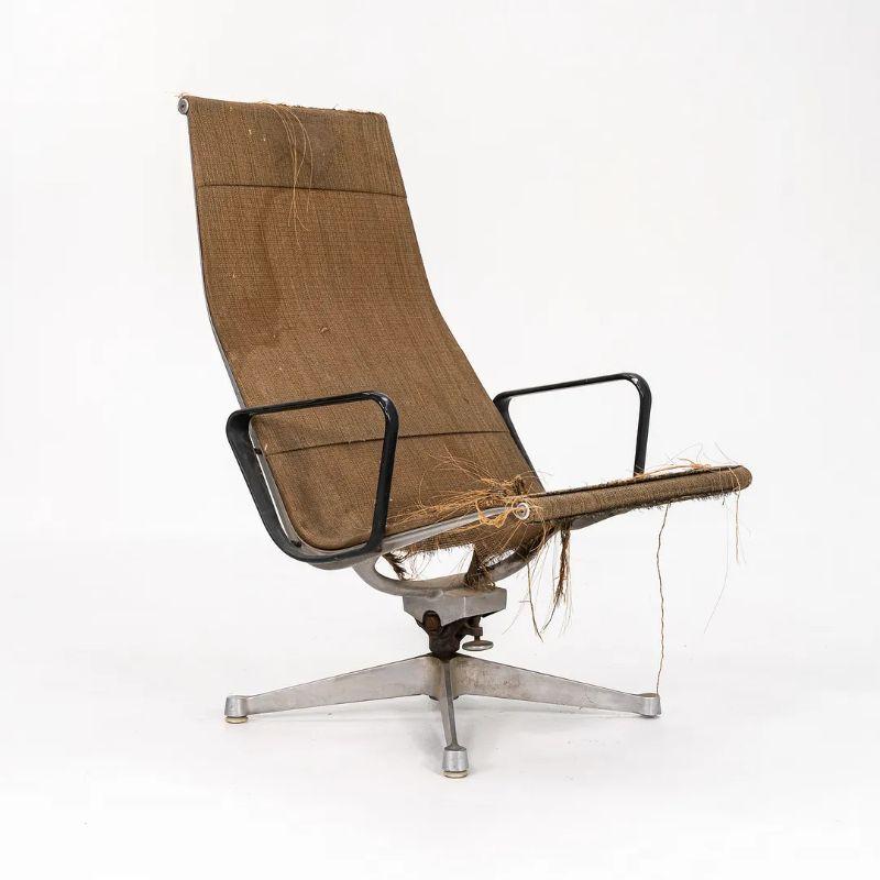 This is an original 1958 Aluminum Group reclining lounge chair, designed by Charles and Ray Eames for Herman Miller. This example is a true collector's item, as the Saran upholstery is quite rare and coveted. It has the Patent Pending stamp branded
