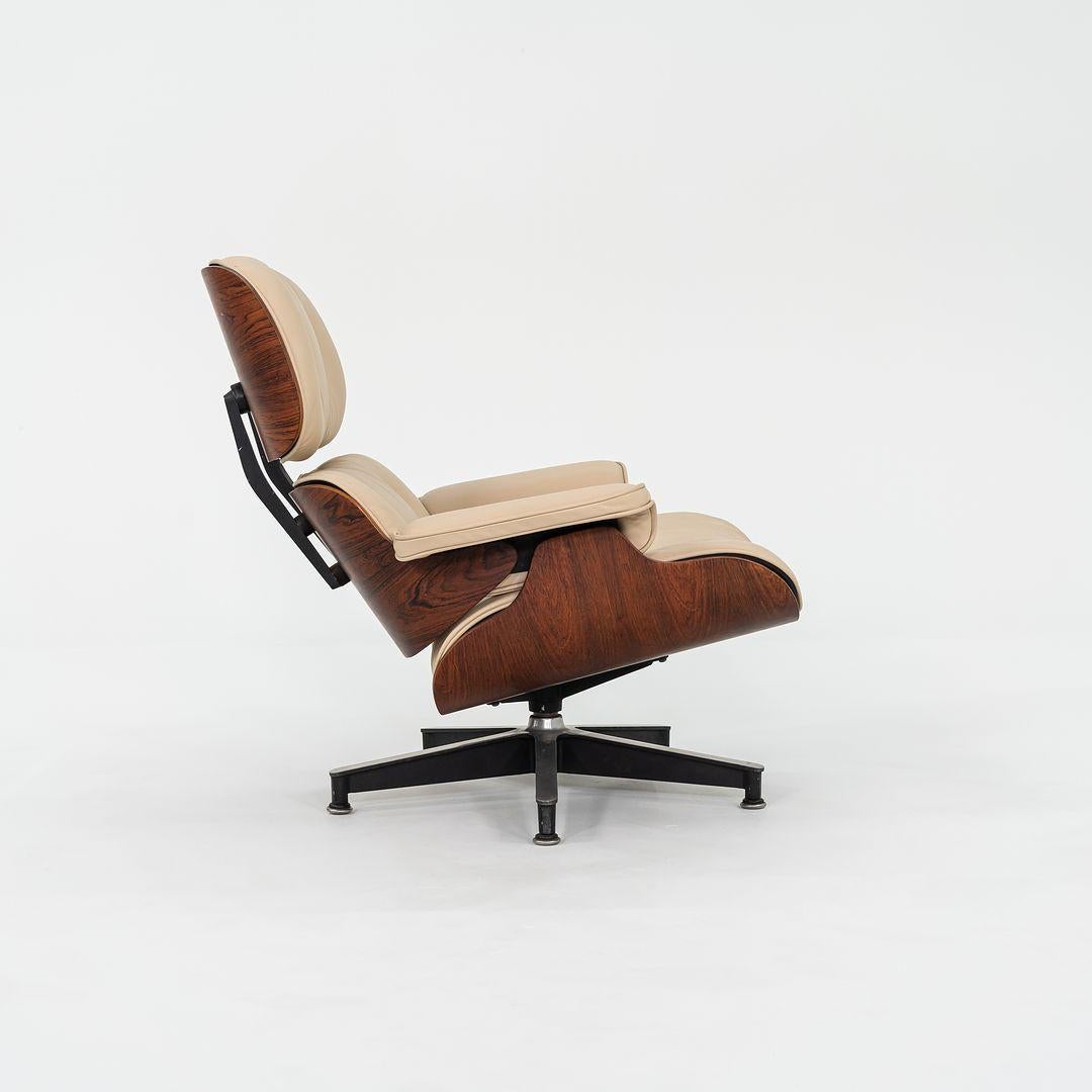 This is an original Eames Lounge Chair and Ottoman, models 670 and 671, designed by Charles and Ray Eames for Herman Miller in 1956. This set dates to ca. 1958. The shells on this set are composed of Brazilian Rosewood, and the upholstery has been