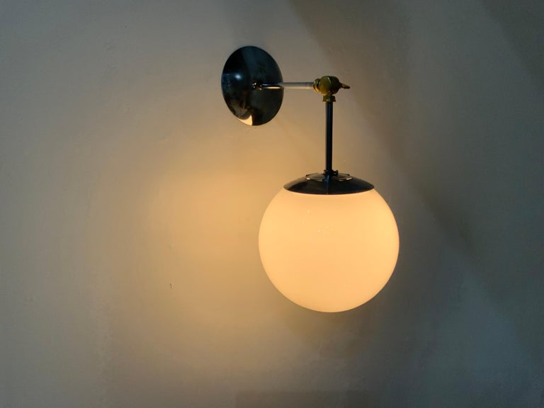We currently have two in stock, where the simple pendant has been converted to a wall light Sconce format using articulating brass hardware.
Salvaged from a building built in 1958 out of seattle.
Rewired and tested.