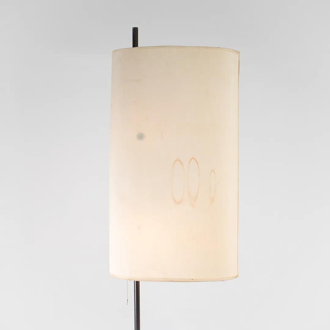 This is an AJ Royal Floor Lamp, designed by Arne Jacobsen for Louis Poulsen in 1956. It was manufactured in Denmark for the SAS Hotel in Copenhagen in 1958. It is formed of matte painted / coated steel and retains its original elliptical fabric