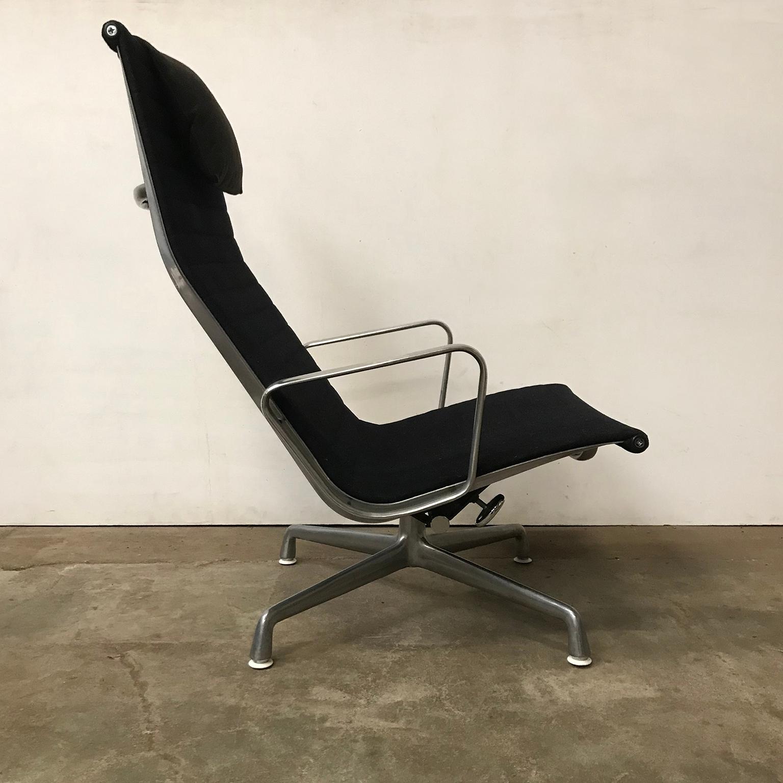 Black EA 124 with dark grey head cushion with glossy base by Herman Miller. This beautiful piece is still in a good condition, although there are some traces of wear like the glossy base became less glossy (pictures #14 and #15) and some loss of the