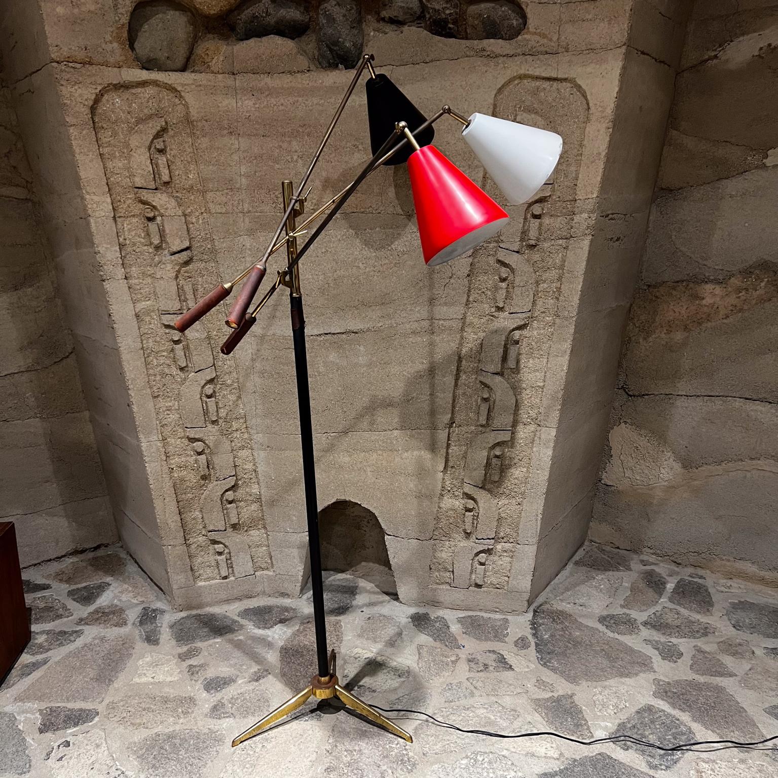 1958 Style Arredoluce early Triennale lamp Italy
Brass with original brown leather.
Shade is black, red and white.
Stamped on top made in Italy.
68.5 h x 32.5 w x 36 d
Expect unrestored original vintage condition. Leather with vintage wear. Brass