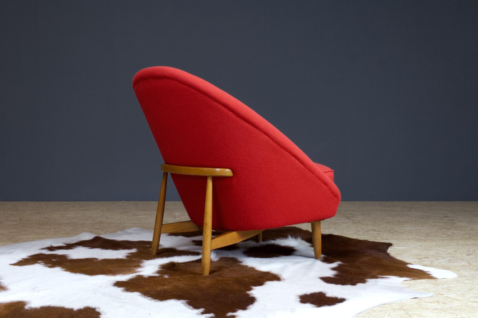 Vintage red club chair model 115 by Theo Ruth for Artifort, 1958 (Dutch Vintage). The back tilts slightly backward and has the recognizable natural flow and comfort of Ruth's design. 

The vintage piece still has a great seating comfort. The fabric