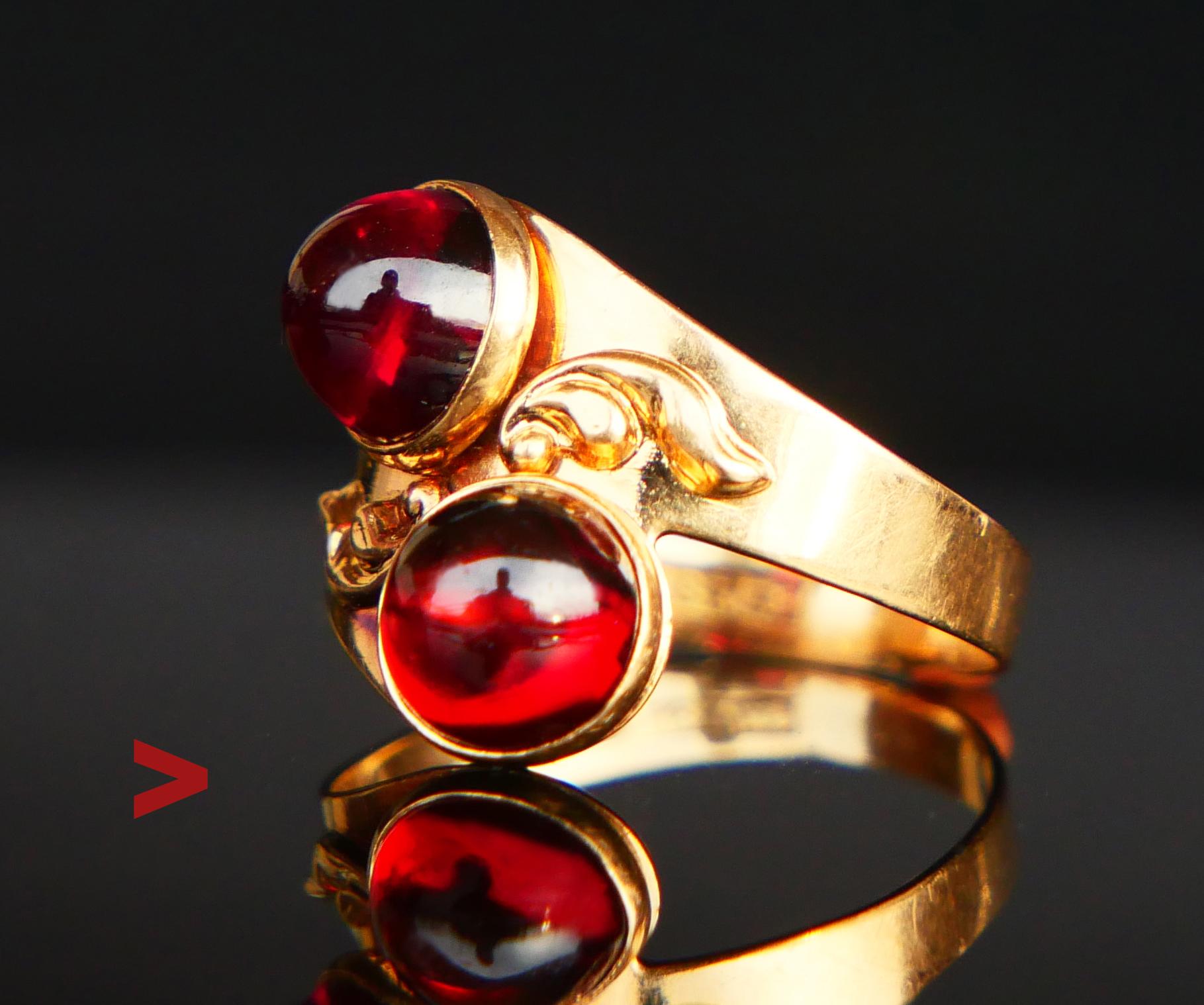 Toi et Moi Ring featuring twisted frame in solid 18K Reddish Gold with two bezel set cabochon cut natural Red Rubellite / Tourmalines Ø 6 mm x 4 mm deep / 1.25 ct. each. Total weight ca. 2.5 ctw.

Swedish hallmarks, 18K, maker's initials, year