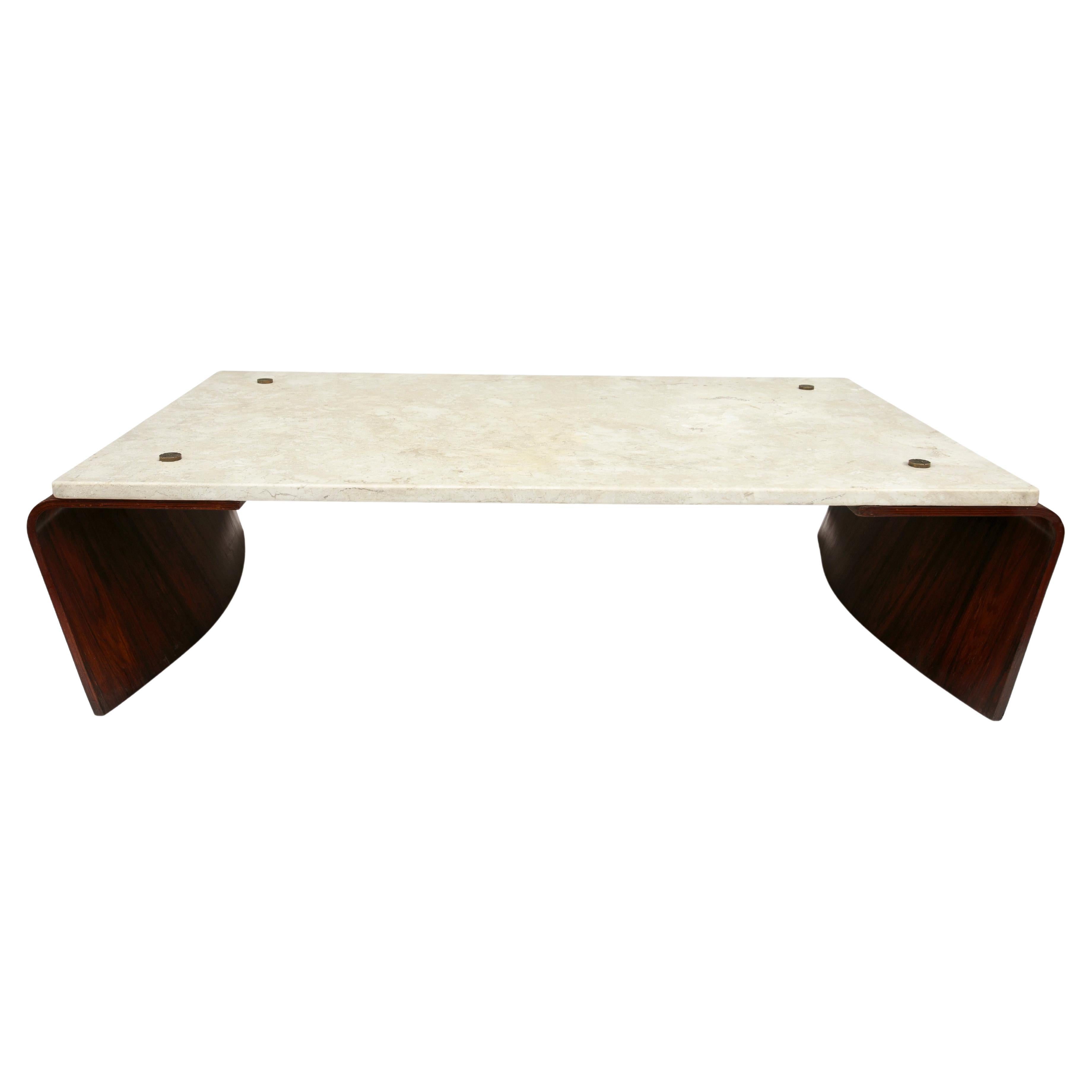 Available today, this “Romana” coffee table, designed by Jorge Zalsziupin in 1959, is nothing less than spectacular. The Romana coffee table is a stunning example of minimalist design. Its use of materials - including curved rosewood legs and a