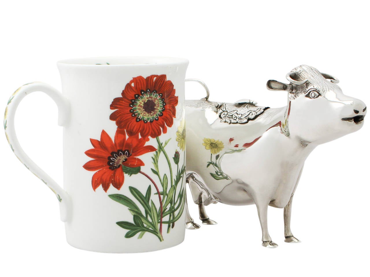 A fine and impressive vintage Elizabeth II English sterling silver cow creamer made in 18th century style; an addition to our silver teaware collection.

This vintage Elizabeth II sterling silver cow creamer has been modeled in the style of an