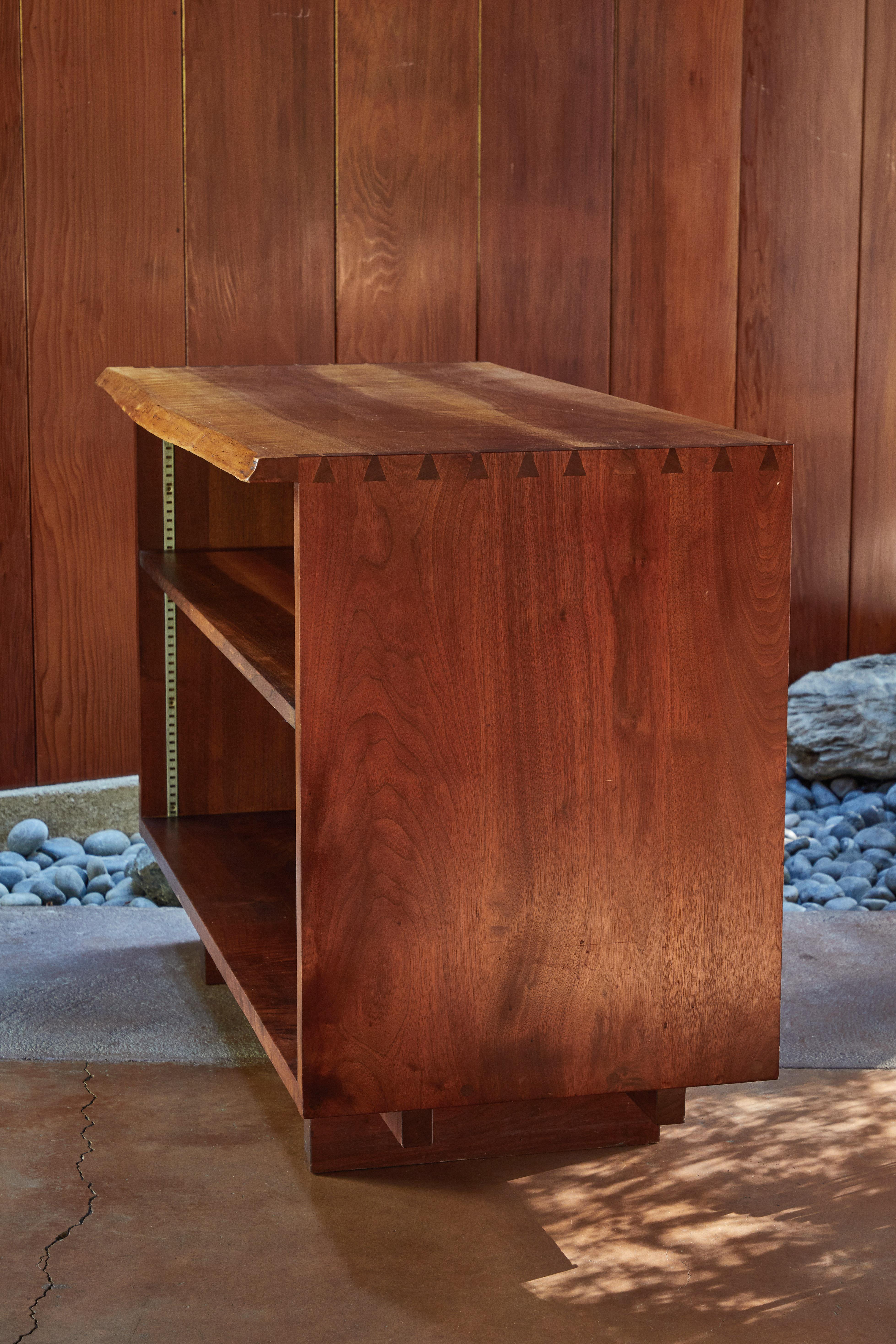 1959 George Nakashima open cabinet in Persian walnut. Executed in beautifully grained Persian walnut by George Nakashima at his legendary studio in New Hope, Pennsylvania. Signed #475 Kornblut. An exceptionally rare and highly refined example of the