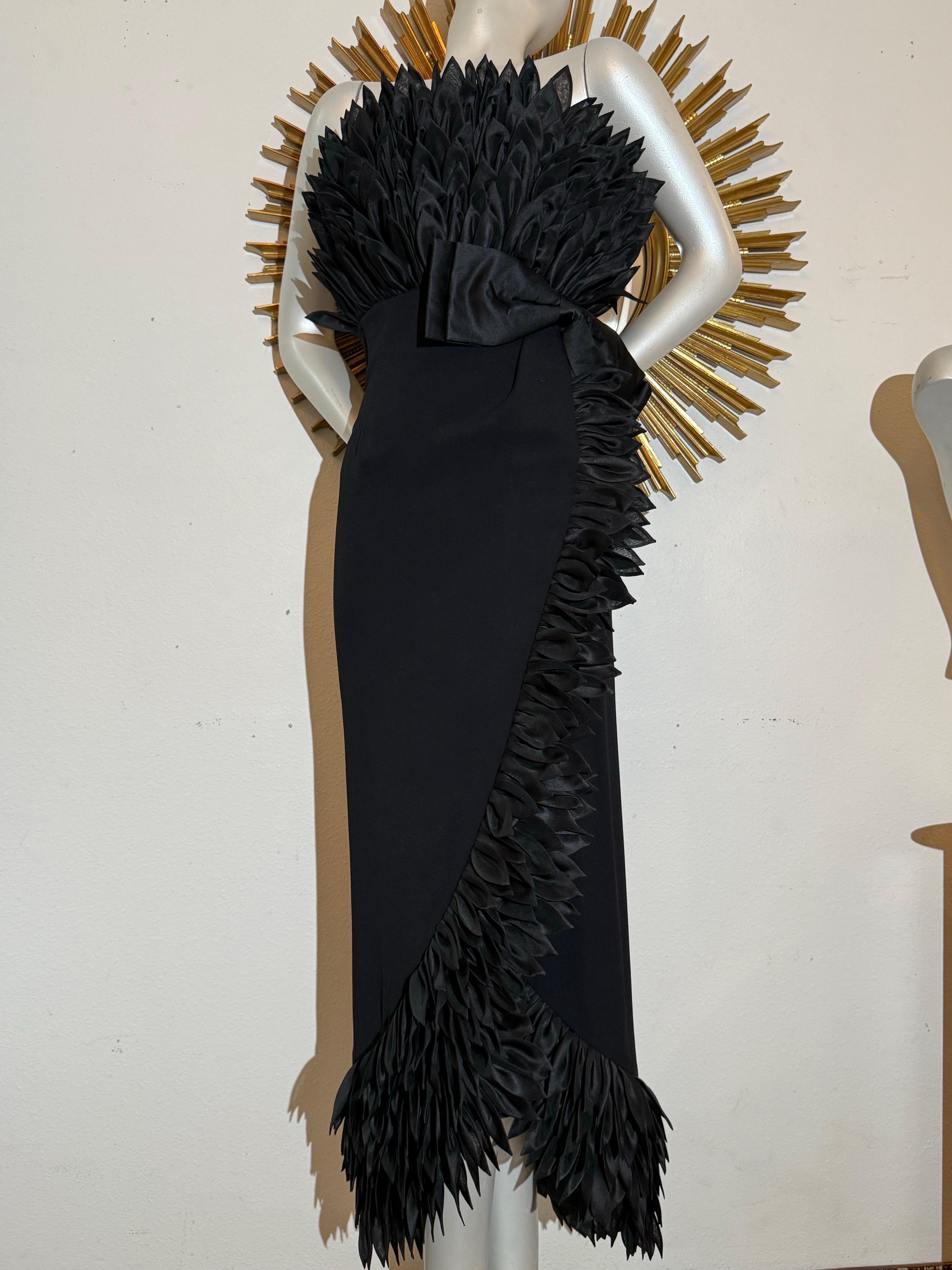 1959 Hall Ludlow Black Evening Gown Worn By Naomi Watts as Babe Paley in Capote vs. The Swans Dramatic Series. An amazing couture 1959 documented Hall Ludlow for House of Karel black evening gown in a wrap style with Empire waist cinched with a bow