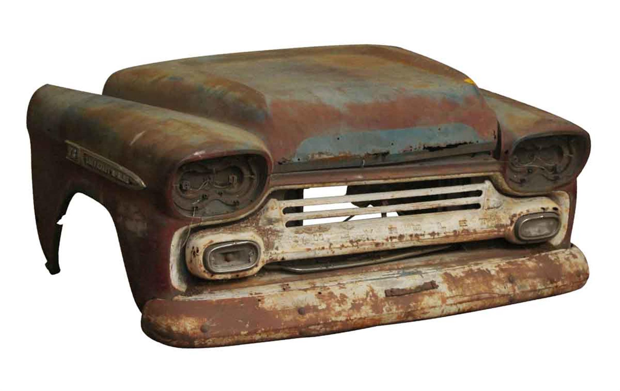 Rusted and banged up front end of a 1959 S8 Chevy Apache pickup truck. This can be seen at our 400 Gilligan St location in Scranton, PA.