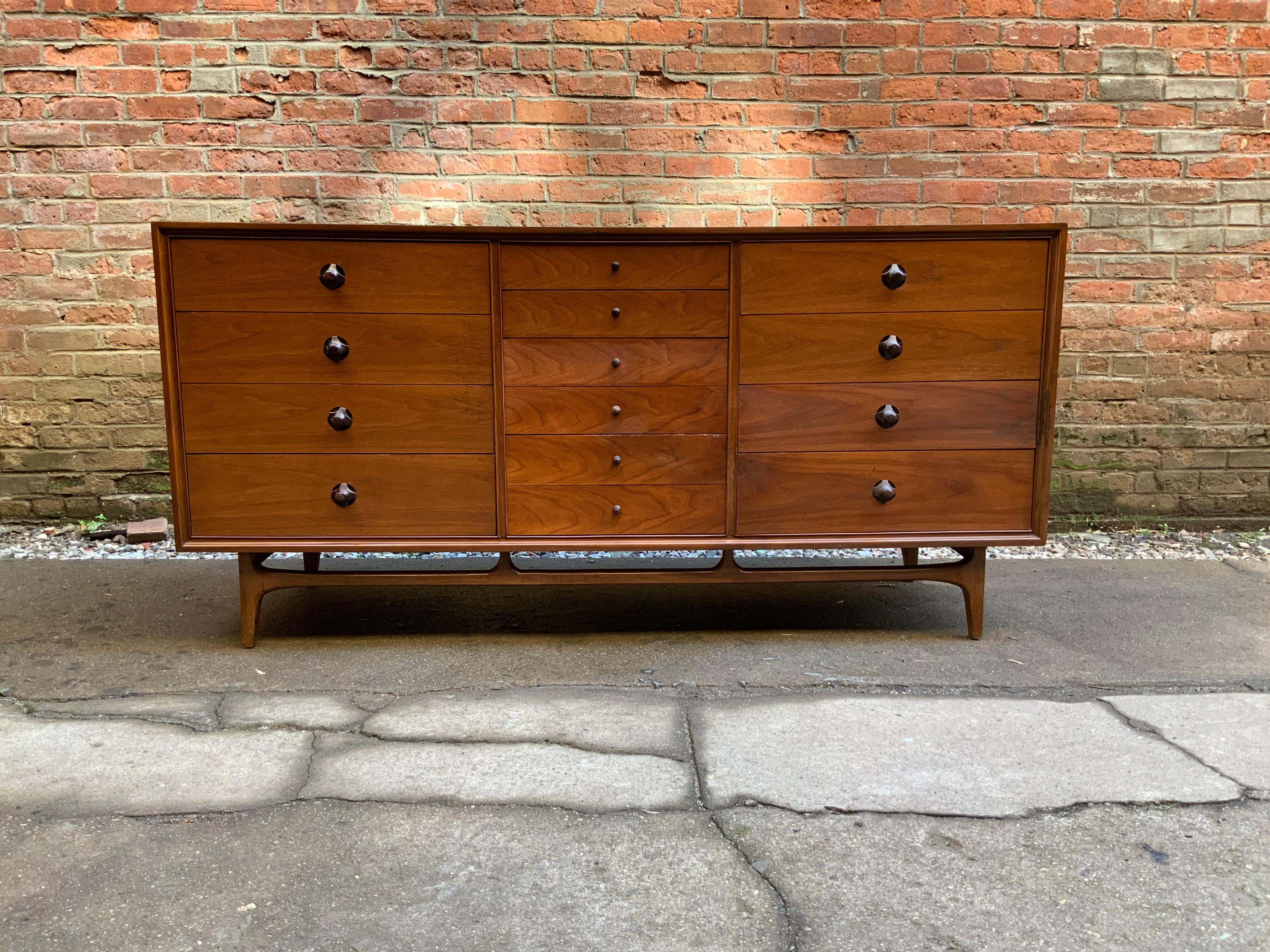 Walnut cabinet with rosewood pulls. Signed and dated on the back, Thomasville Chair Company, copyright 1959. Oiled finish.

Measures: 19