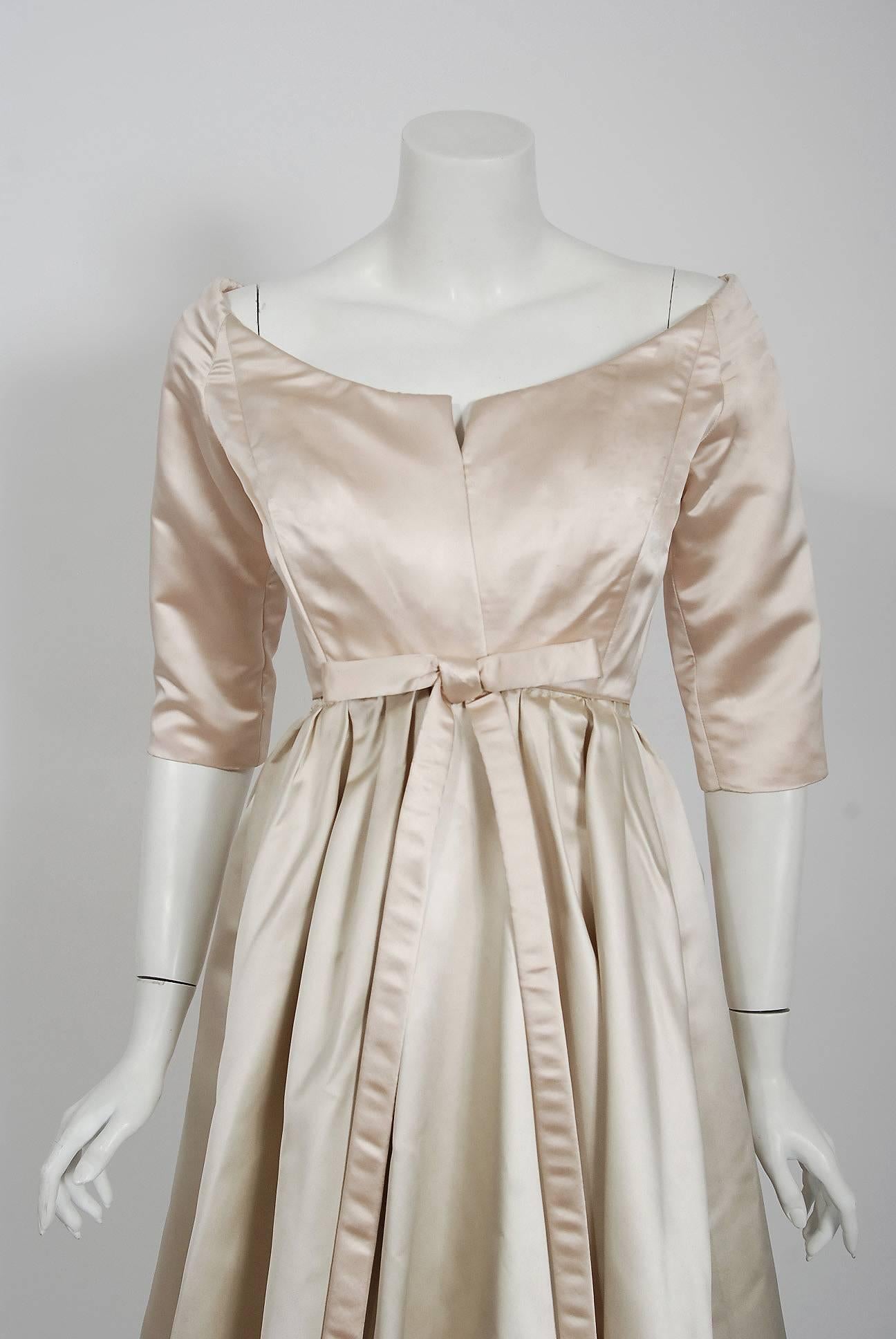We are pleased to offer this important and incredibly rare documented party dress from the Christian Dior Couture collection of 1959 when Yves Saint Laurent was head designer. Yves Saint Laurent continued the Dior tradition of elegant construction