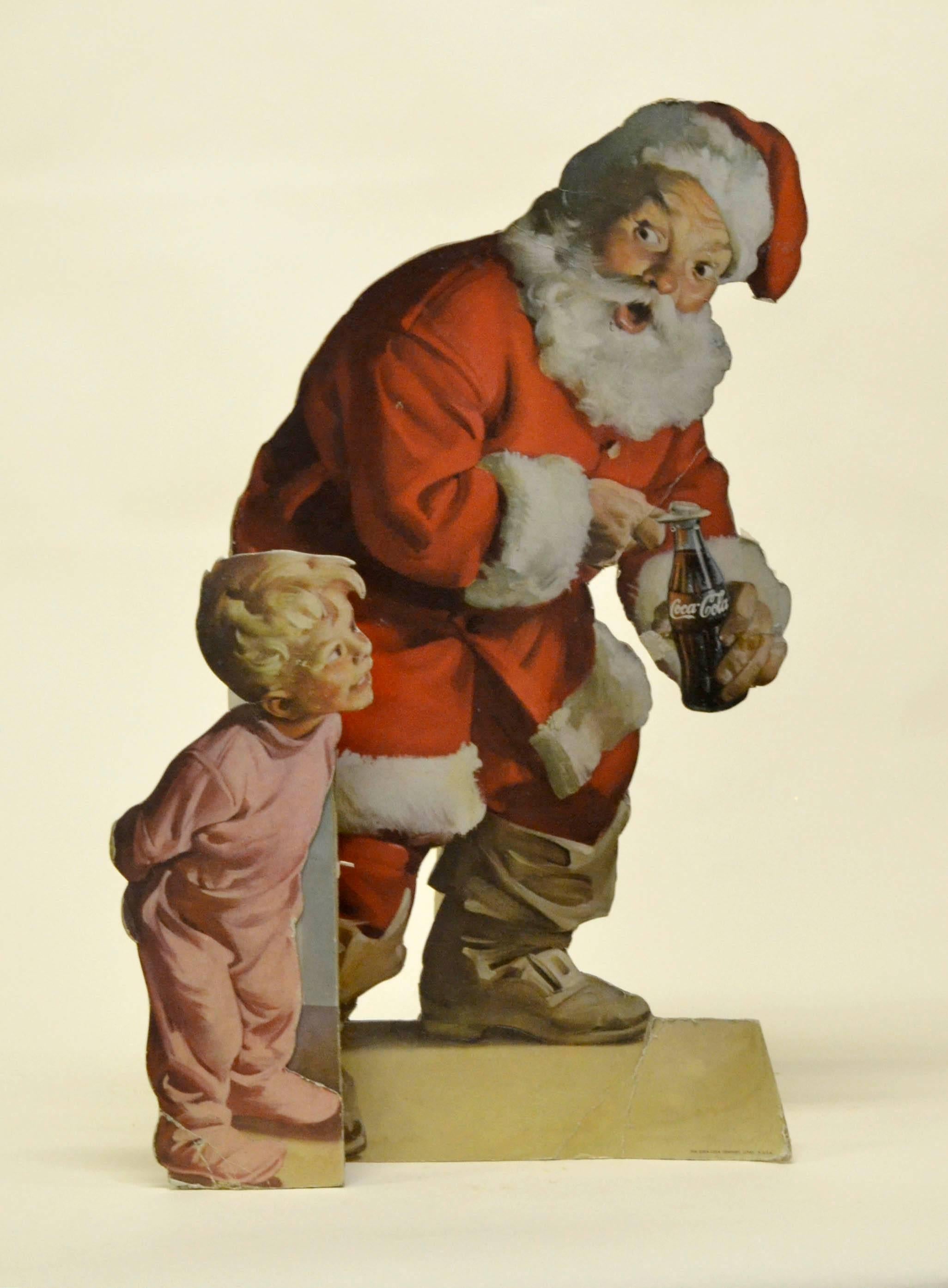 1959s vintage America Coca Cola Santa Claus store display sign with easel back. 
Signed on the back: The Coca-Cola Company Litho in USA.

Collector's note:

Haddon Hubbard Sundblom was born in 1899 in Muskegon, Michigan and his family moved to moved