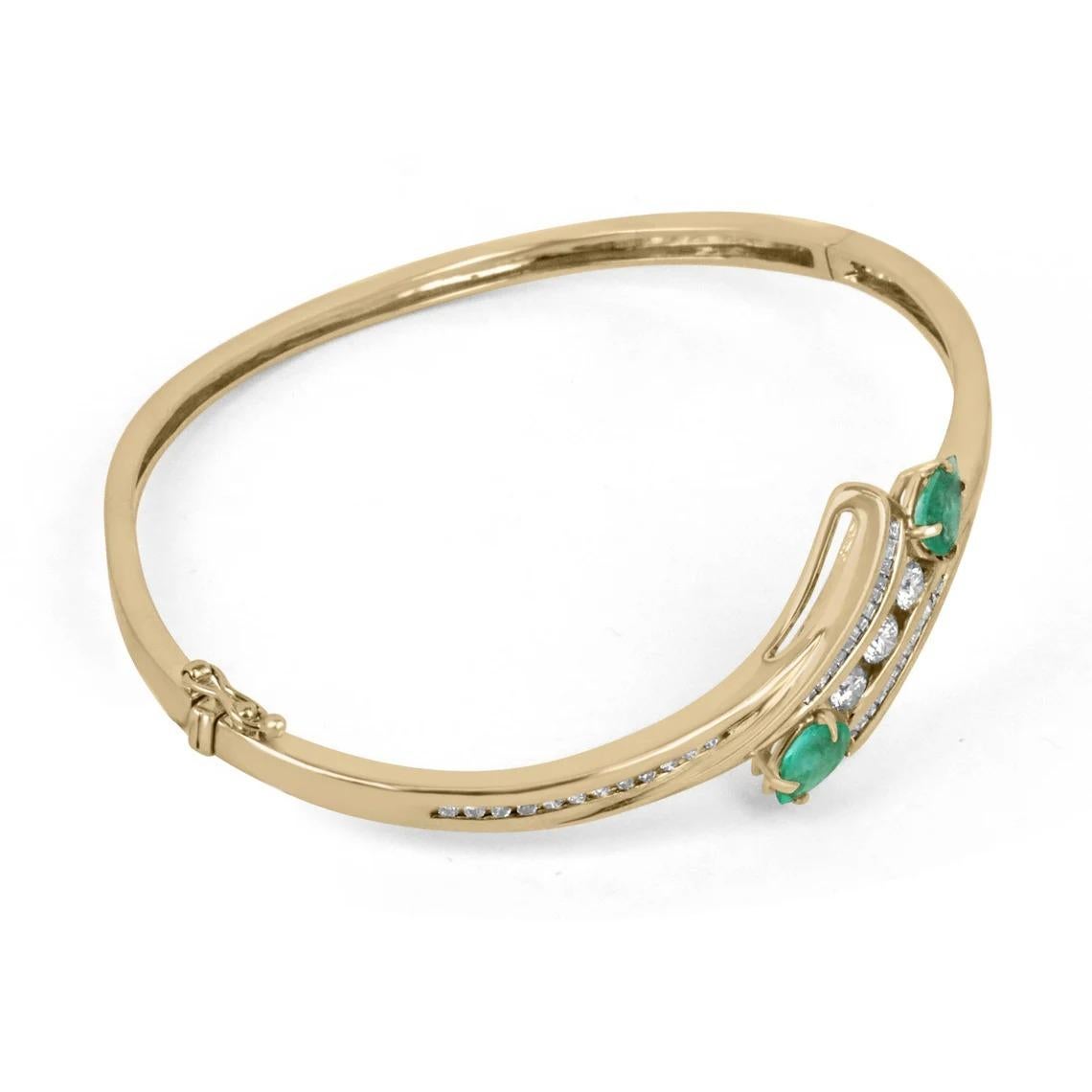 A remarkable emerald and diamond bangle bracelet. Two beautiful pear-cut Colombian emeralds accent the sides of the three brilliant round-cut diamonds that are tension set within the center. A split design with petite brilliant round cut diamonds