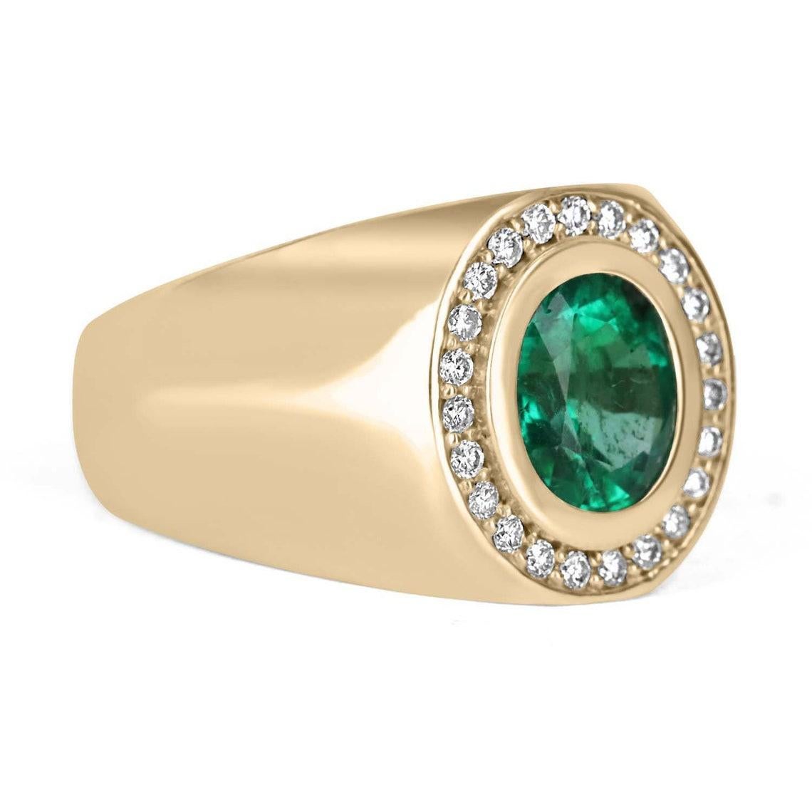 An important Colombian emerald and diamond men's cocktail ring. A large 1.70-carat emerald is bezel set in the very center. The men's ring is made in solid 14K yellow gold and is accented by brilliant round diamonds. This ring has excellent spread