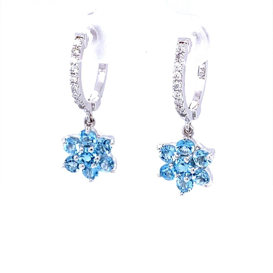 Aquamarine and Diamond Drop Earrings! 

These stunning earrings have 16 Aquamarines set in a flower like design that weigh 1.78 Carats and are embellished with 18 Round Cut Diamonds that weigh 0.18 Carats (Clarity: SI2, Color: F). The total carat