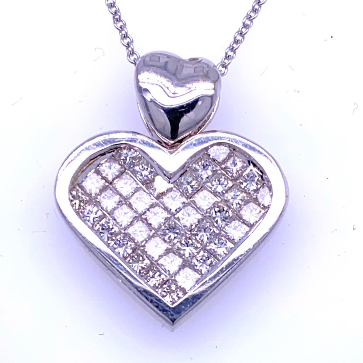 18K Gold Heart shaped Pendant with 40 Invisible Set Princess Cut Diamonds   with total weight of 1.96 Ct. 
Total Diamond Weight: 1.96 Ct
Total Necklace Weight: 8.9 gr
Pendant Size 21x25 mm (4.5 mm depth)
Chain is not included