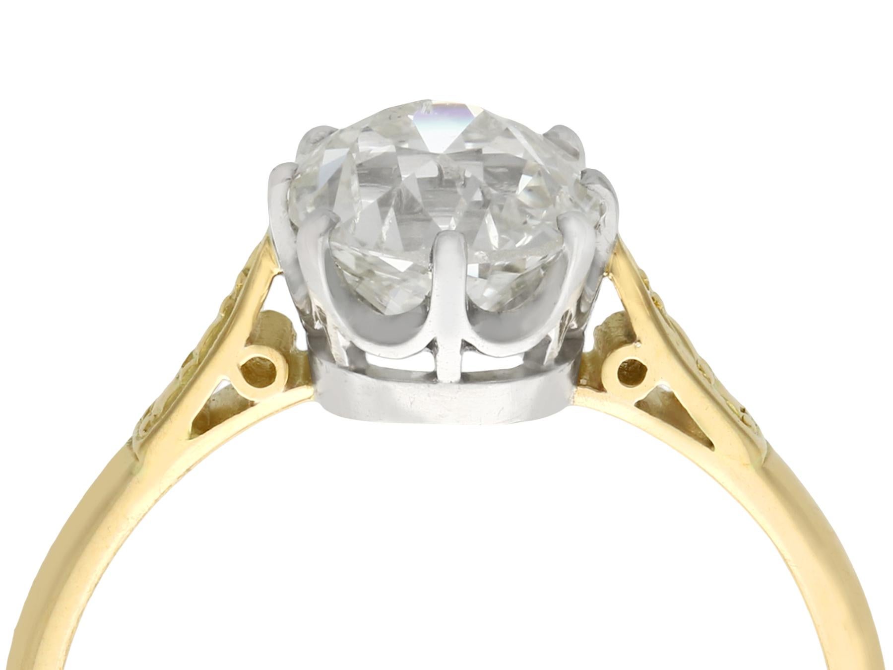 An impressive antique 1.96 carat diamond and 18 karat yellow gold, platinum set solitaire engagement ring; part of our diverse diamond jewelry collections

This fine and impressive antique solitaire engagement ring has been crafted in 18k yellow