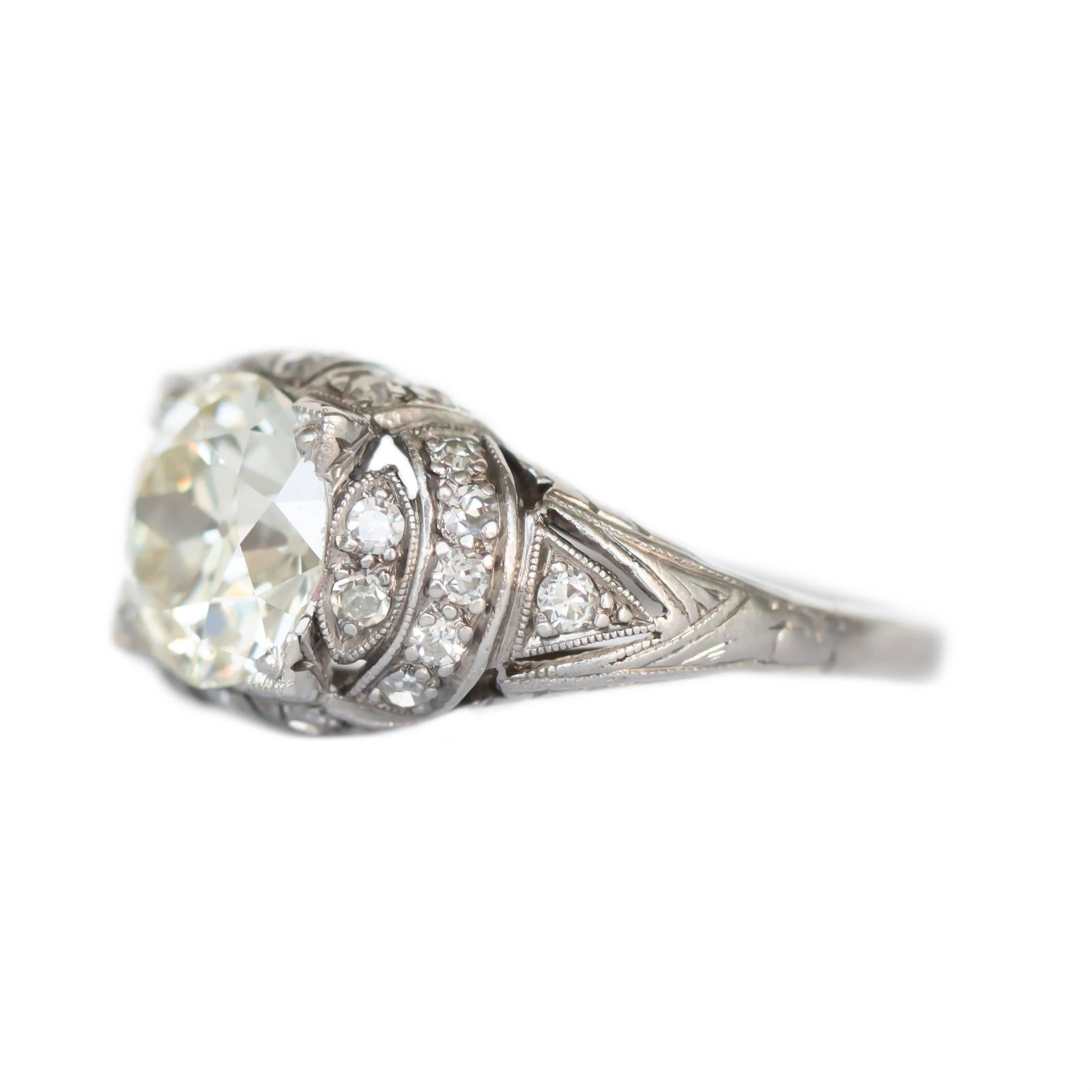 Item Details: 
Ring Size: 5.95
Metal Type: Platinum
Weight: 4.7 grams

Center Diamond Details
Shape: Old European Brilliant
Carat Weight: 1.96 Carat
Color: L
Clarity: VS1

Side Stone Details: 
Shape: Antique European cut 
Total Carat Weight: .20