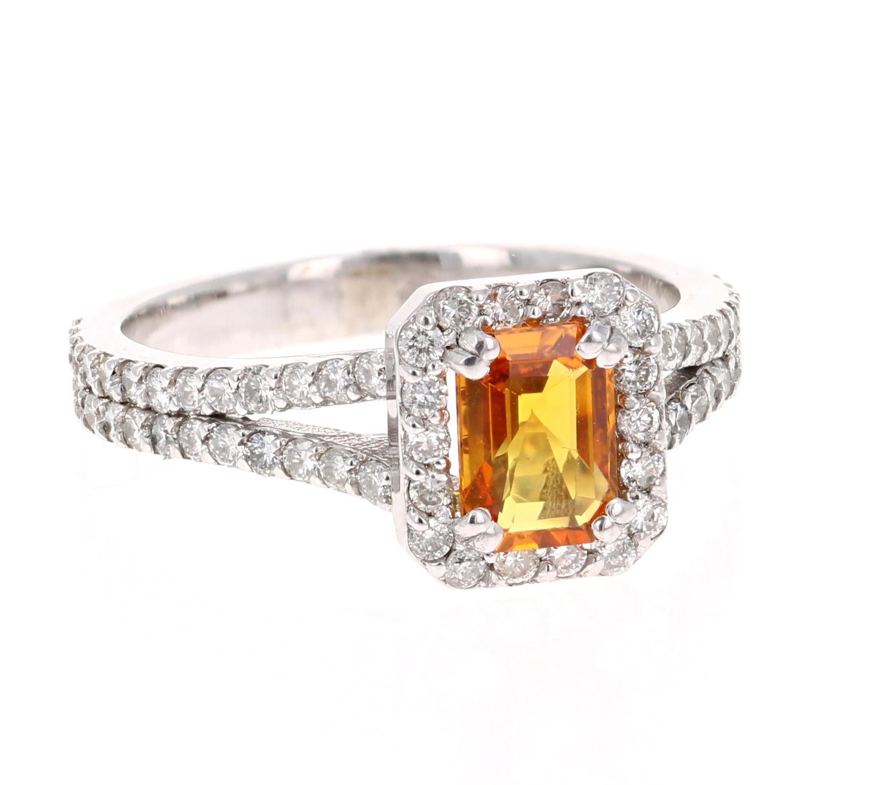 A gorgeous Orange Sapphire and Diamond Ring set in White Gold. It can be the most beautiful and unique Engagement Ring. 
The Emerald Cut Orange Sapphire is 1.12 carats and is surrounded by 70 Round Cut Diamonds weighing 0.84 Carats. The total carat