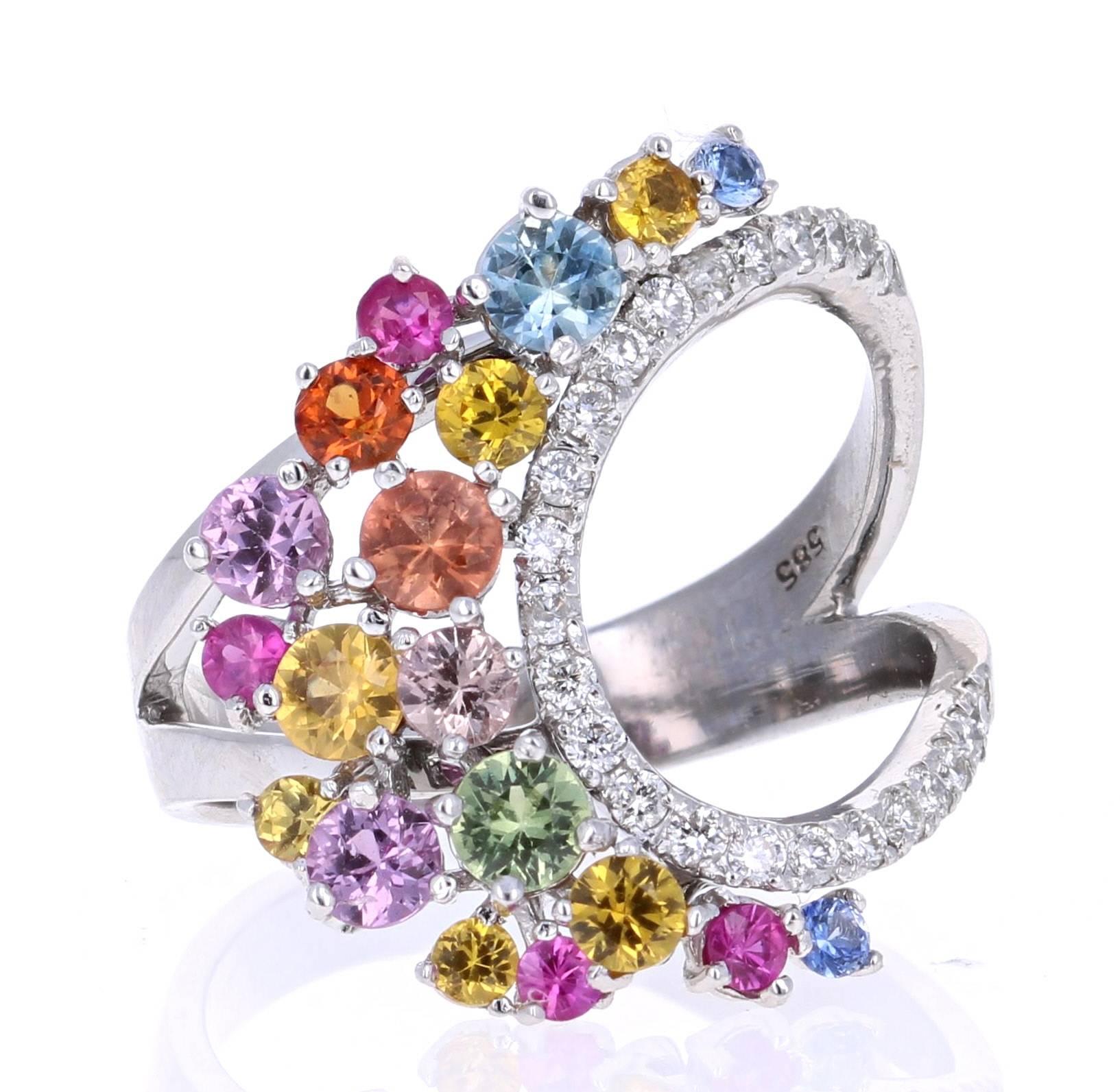 Super gorgeous and uniquely designed 1.96 Carat Multi-Colored Sapphire and Diamond 14K White Gold Cocktail Ring!

This ring has a cluster of 19 Round Cut Multi-Colored Sapphires that weigh 1.70 carats and 24 Round Cut Diamonds that weigh 0.26 carats