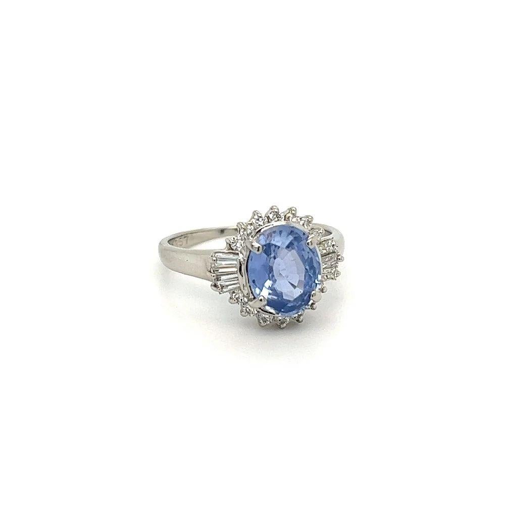 Simply Beautiful! Finely detailed Blue Sapphire and Diamond Platinum Cocktail Ring. Centering a securely nestled Hand set, Natural Blue Sapphire weighing approx. 1.96 Carats. Surrounded by Baguette and Round Diamonds, approx. 0.41tcw. The Ring is