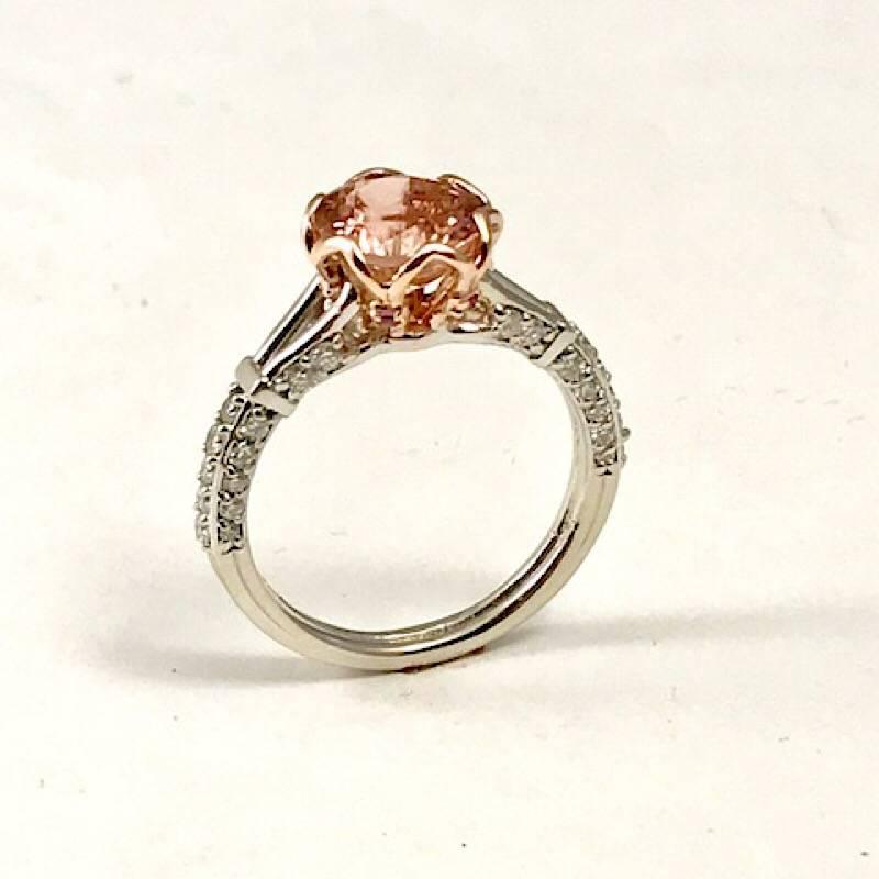 1.96 Carat Peach Tourmaline Set in 14k Rose Gold Engagement Ring.
This beautiful Engagement or cocktail ring has a peachy pink Tourmaline set in the center, it weighs 1.96cts. The Tourmaline is wrapped in 14k Rose Gold with Pink Sapphires. The rest