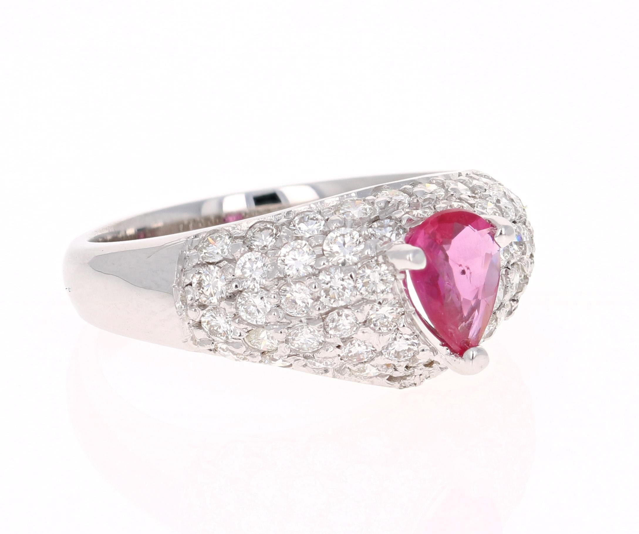 A simple yet beautiful ring with a 0.59 Carat Pear Cut Ruby as its center and 56 Round Cut Diamonds that weigh 1.37 carats.  The Clarity and Color of the Diamonds is VS2 and H Color. The total carat weight of the ring is 1.96 carats.

The ring is