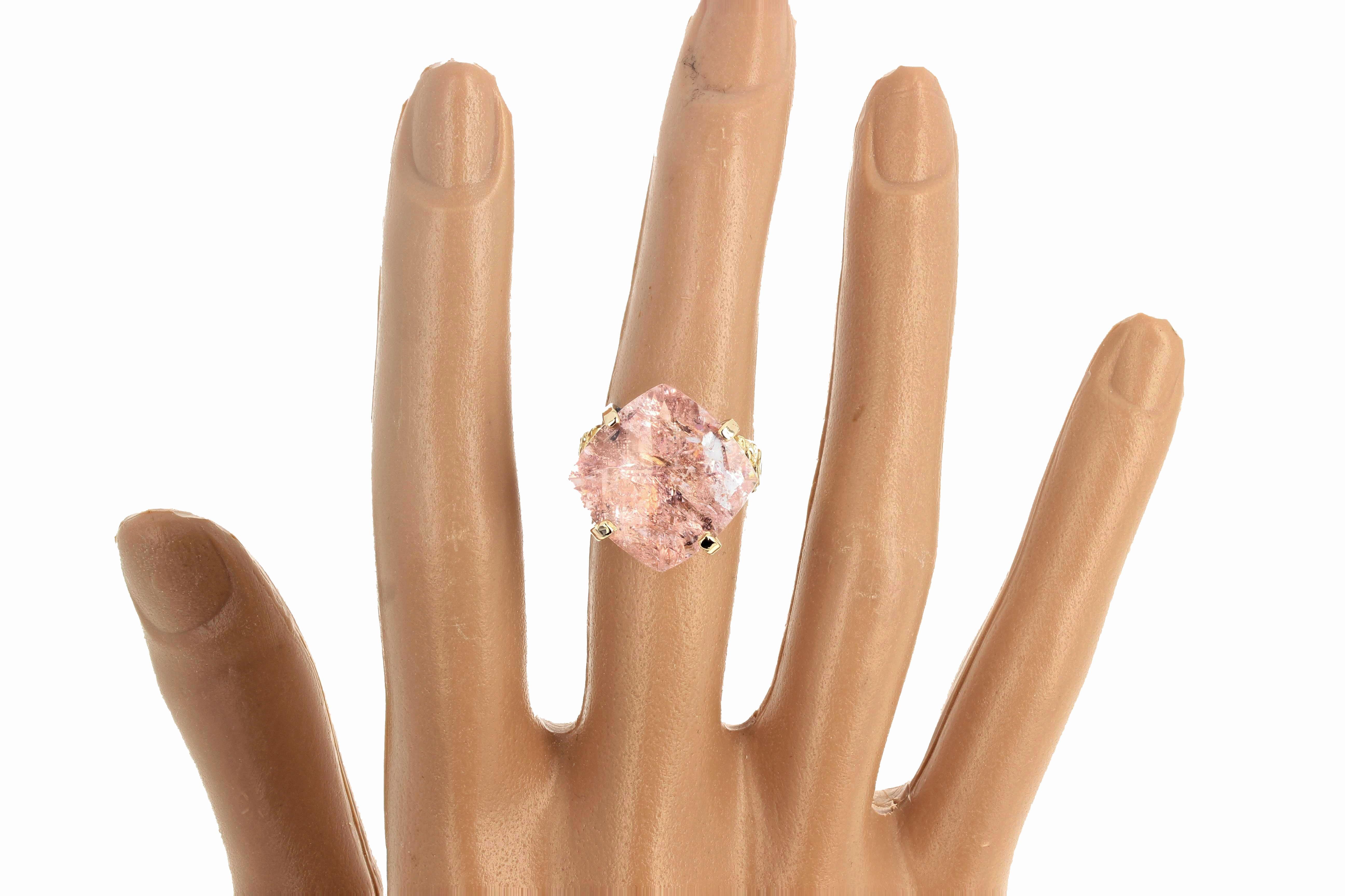 This glittering checkerboard gem cut Morganite (19.6 carats) is set in a beautiful 10Kt yellow gold ring size 7 (sizable).  It glitters so much it looks almost as if its winking at you and is much more beautiful than these photographs.  