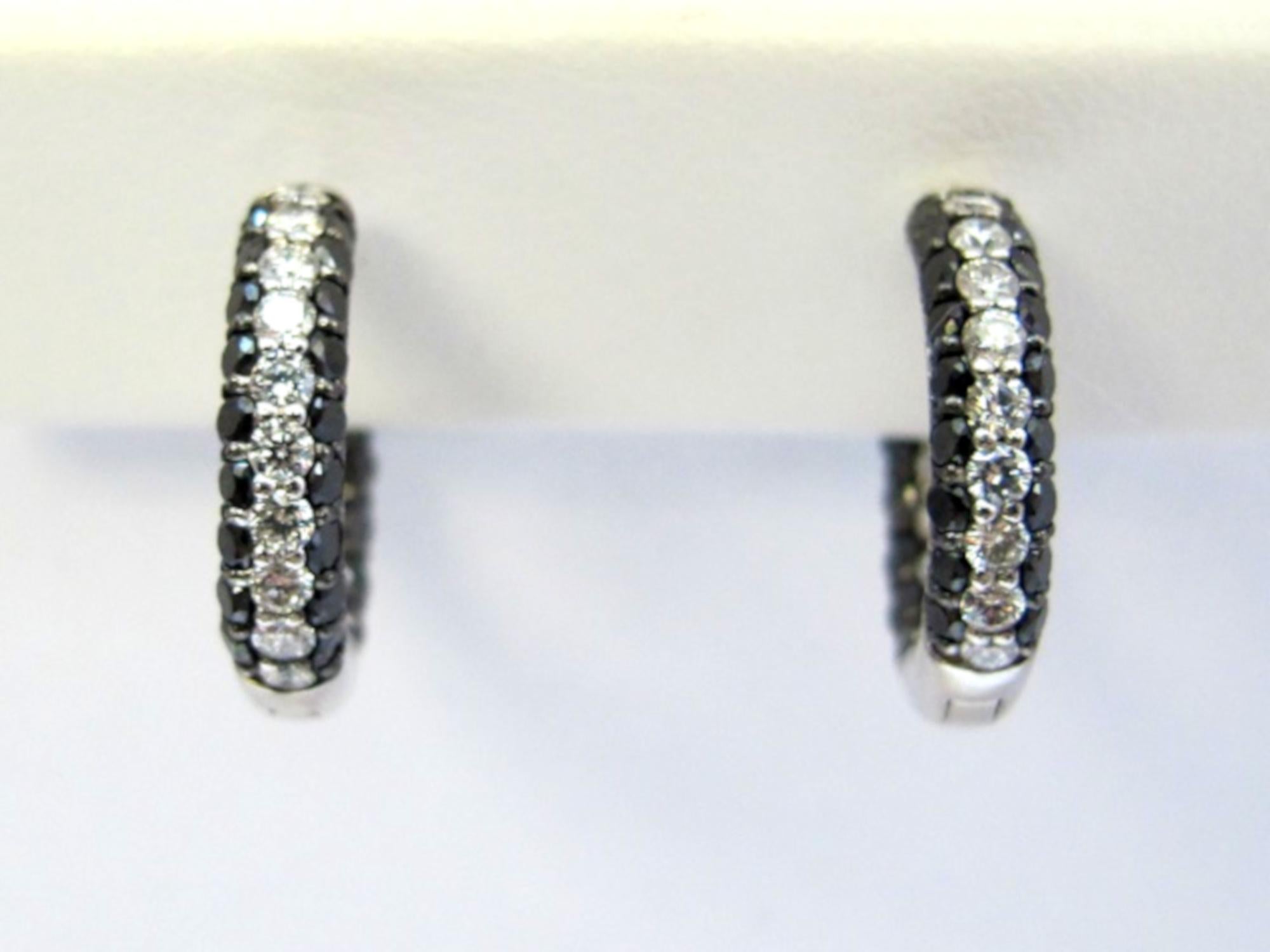 Paint the town black and white in these hoop earrings of contrasting black diamonds (1.33 carats total weight) and white diamonds (.63 carats total weight).  They are so pretty and unusual, with the diamonds being set both on the inside and outside