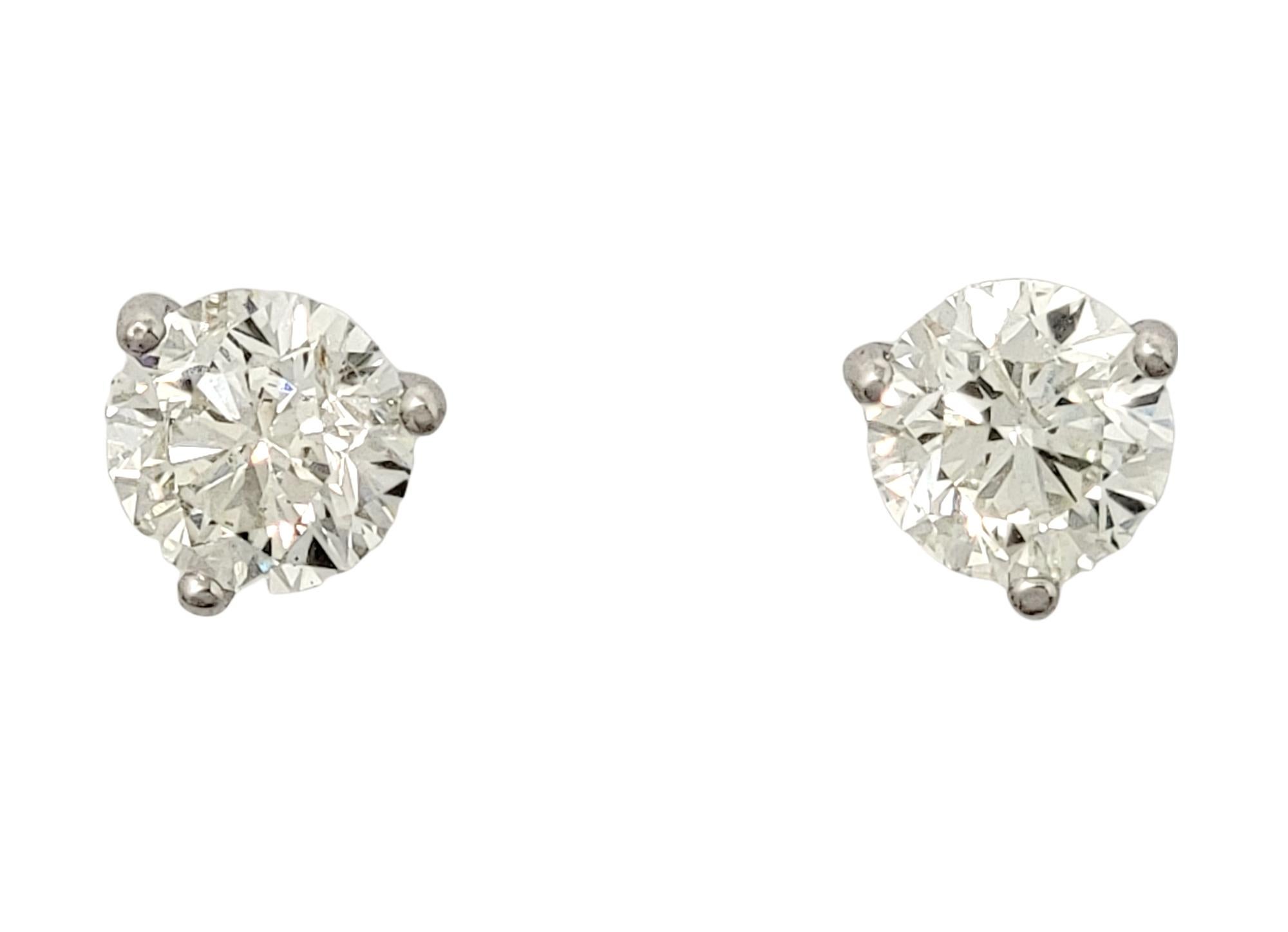 Utterly timeless diamond solitaire stud earrings. These gorgeous round diamond and white gold pierced ear studs are the epitome of minimalist elegance. The simple yet elegant design can be worn with just about anything, making these your new