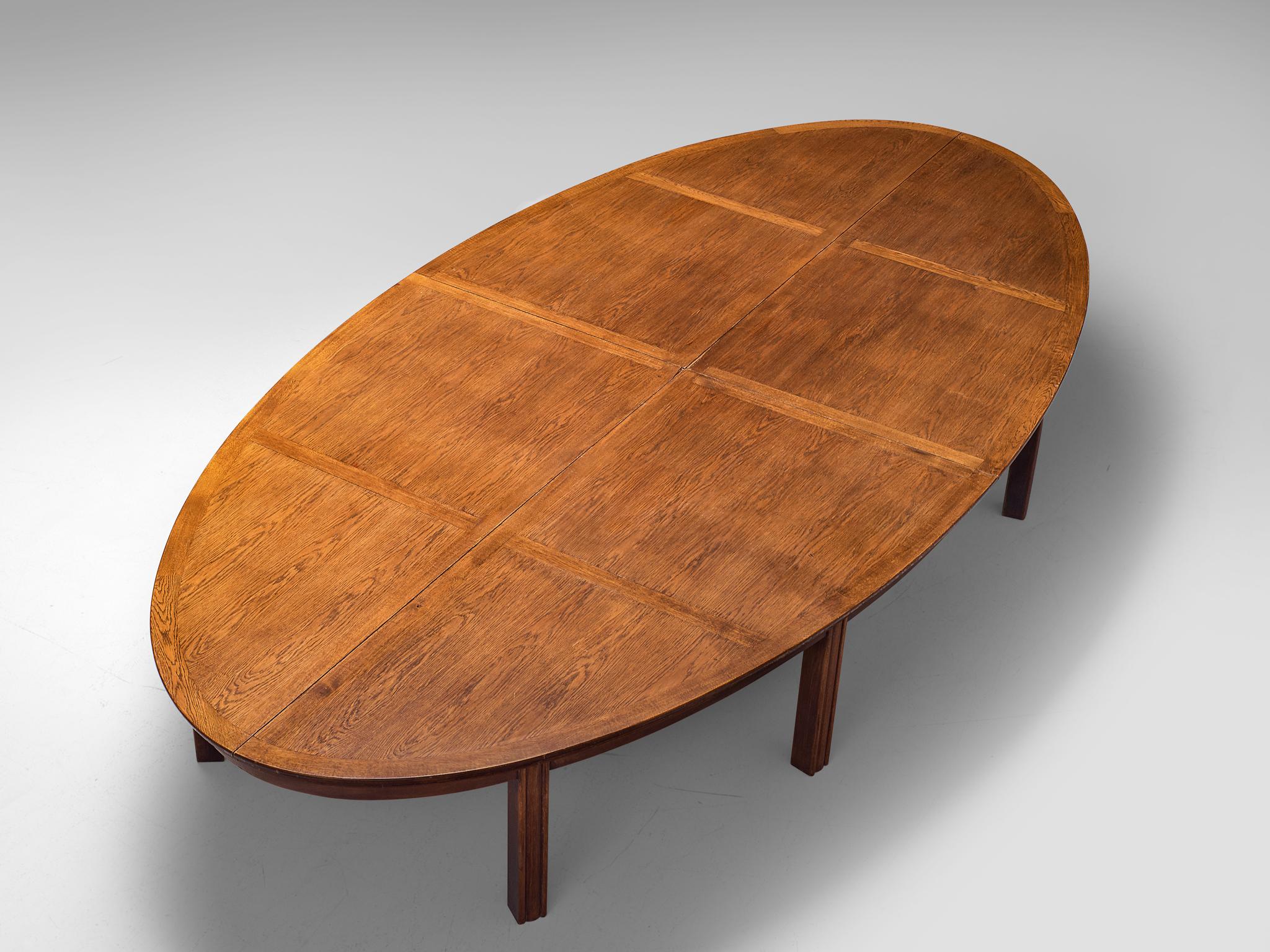 Conference or dining table, oak, the Netherlands, 1950s

Beautiful aged large conference or dining table manufactured in the Netherlands in the 1950s. The wonderfully oval-shaped tabletop is inlayed with oak wood. A grid is created that structures