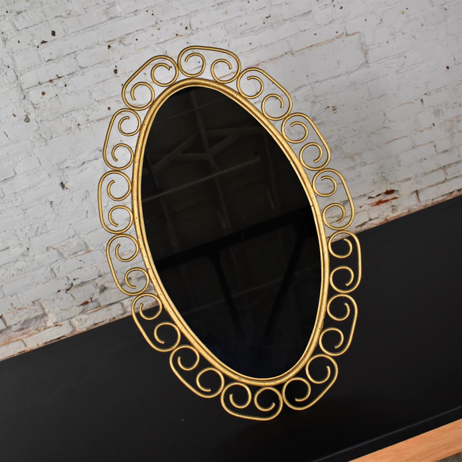Wonderful vintage Hollywood Regency Bohemian free standing mirror with gold painted wicker scroll clad frame and easel style back. Beautiful condition, keeping in mind that this is vintage and not new so will have signs of use and wear. Please see